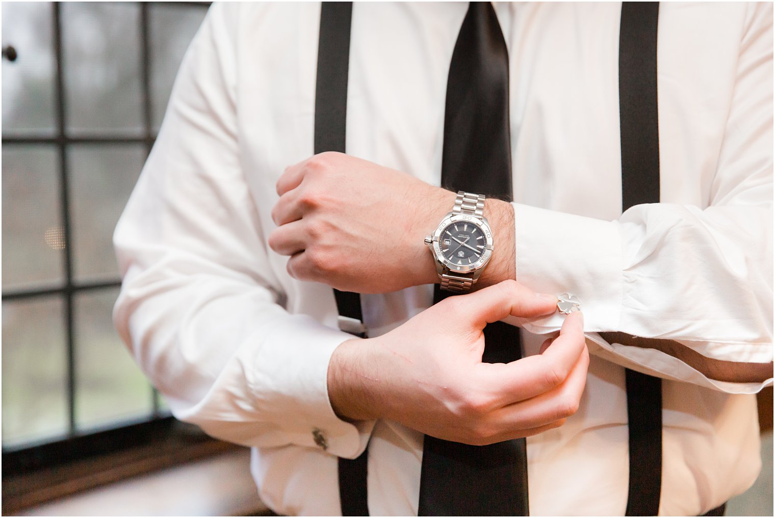 Groom details of button and watch