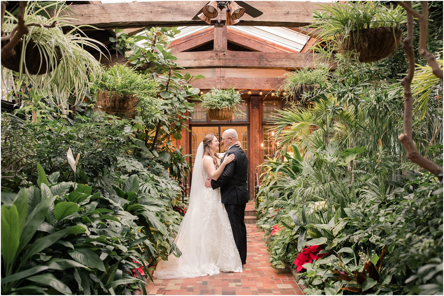 bride and groom greenhouse photo at Pleasantdale Chateau