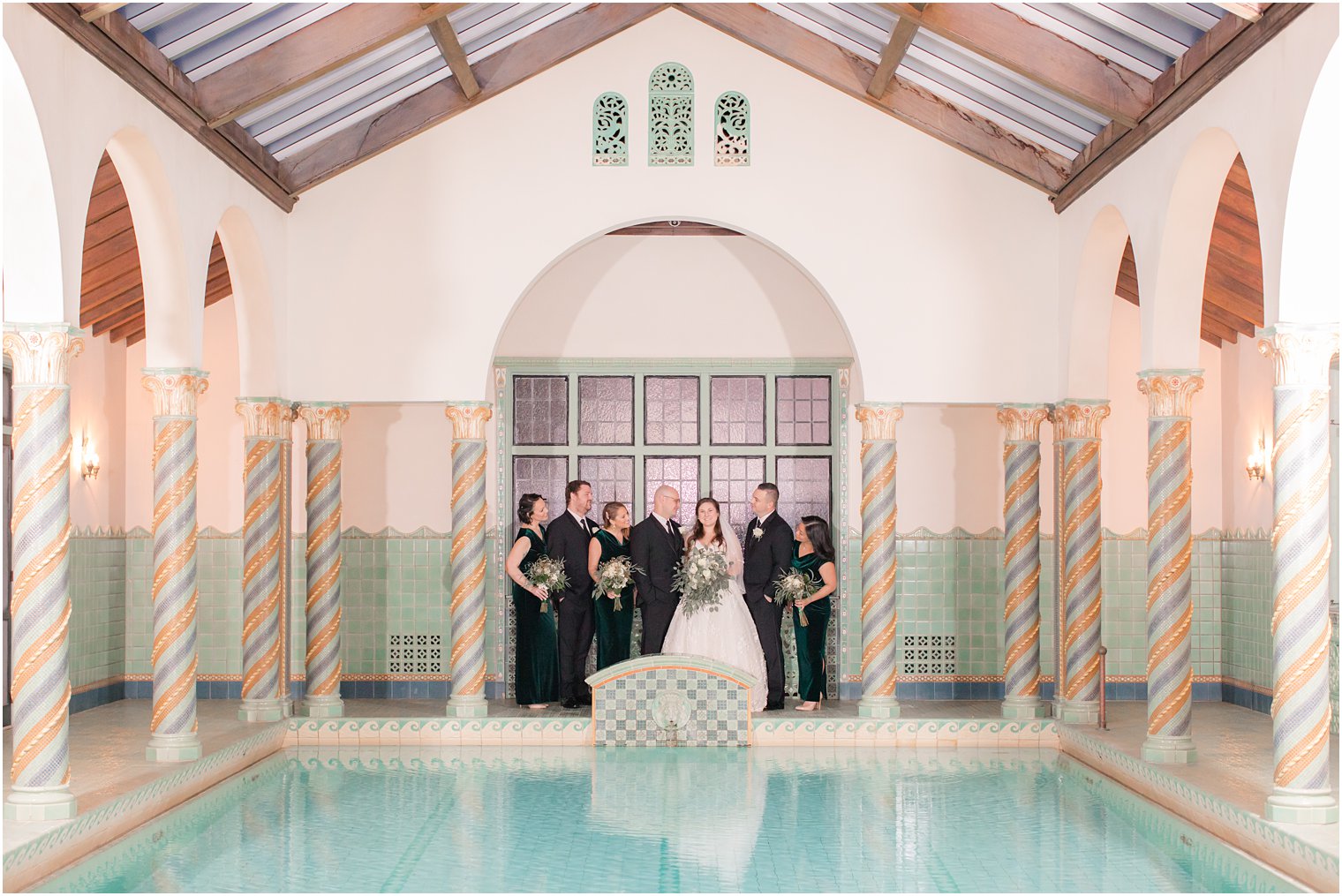 bridal party photo at pool at Pleasantdale Chateau