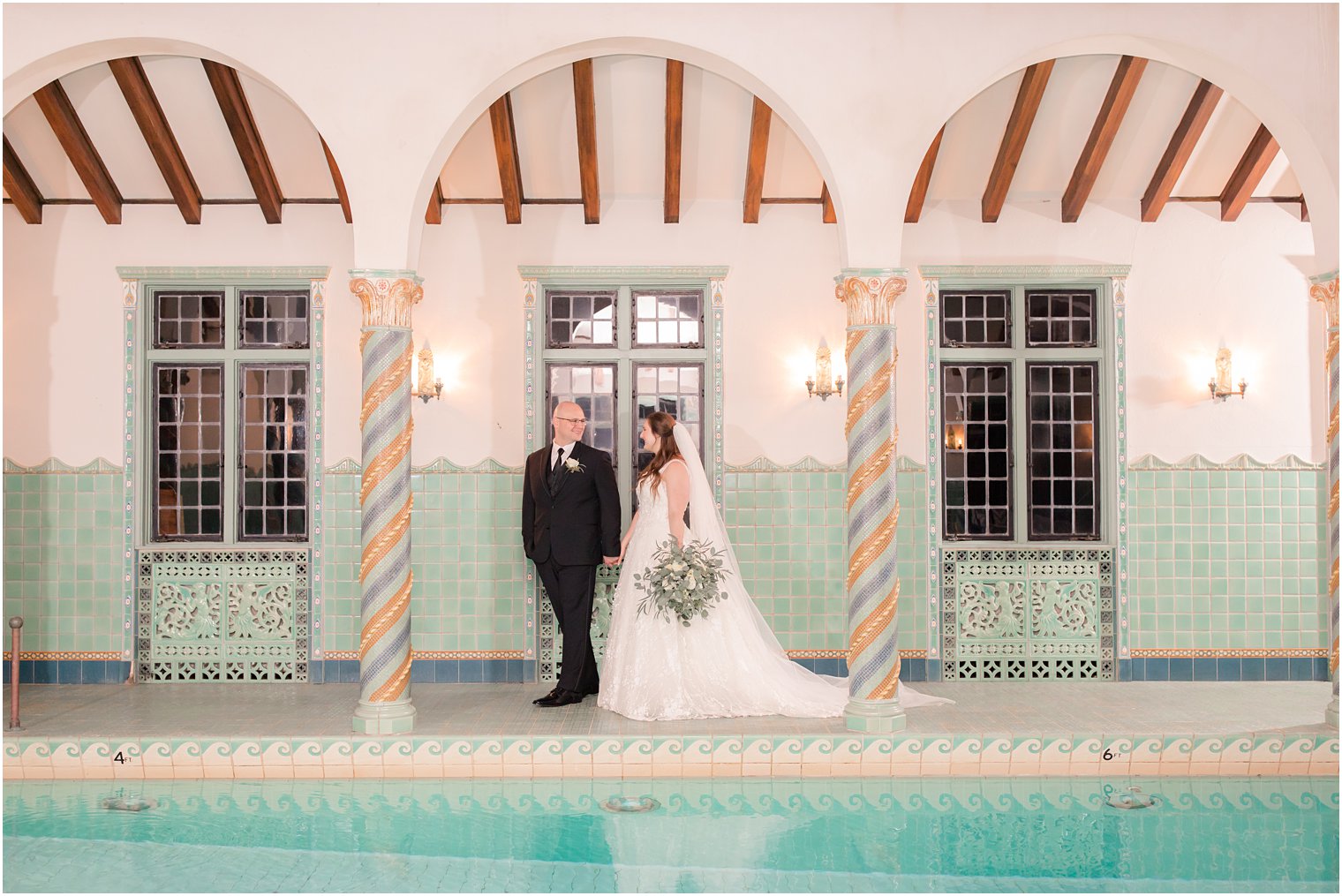 bride and groom in pool at Pleasantdale Chateau