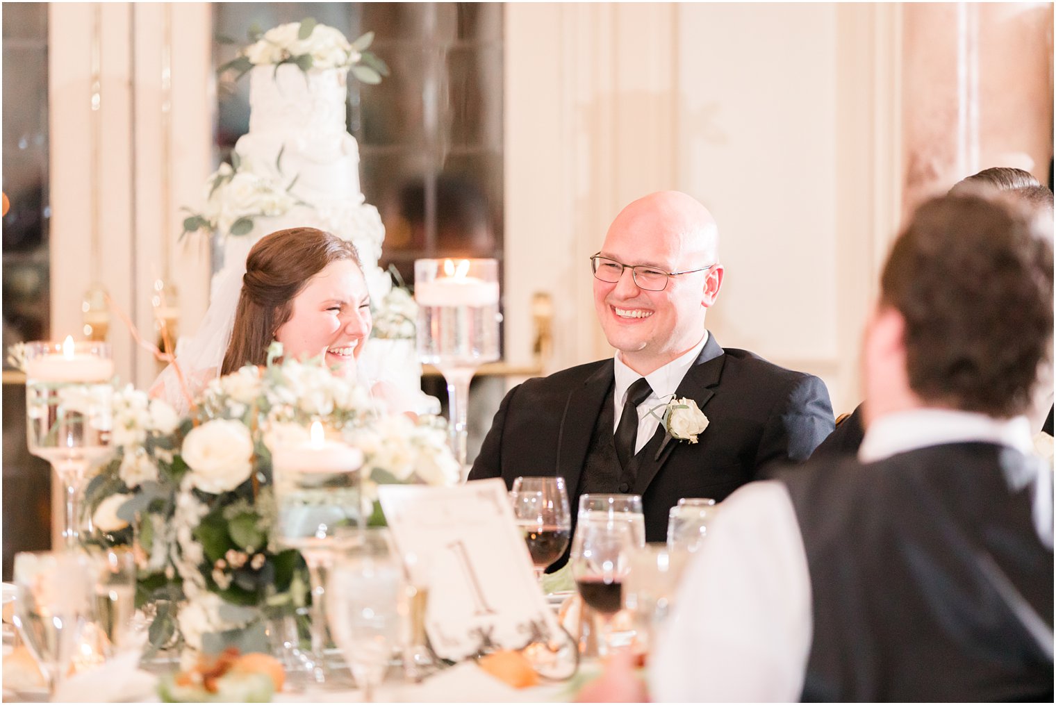 toasts during their wedding reception at Pleasantdale Chateau