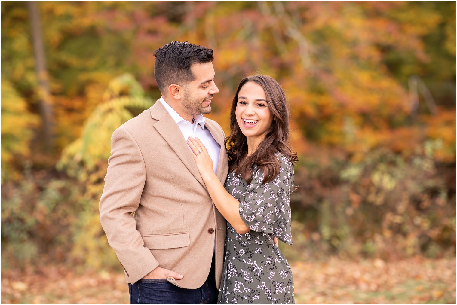 engaged couple laughing during their engagement session 