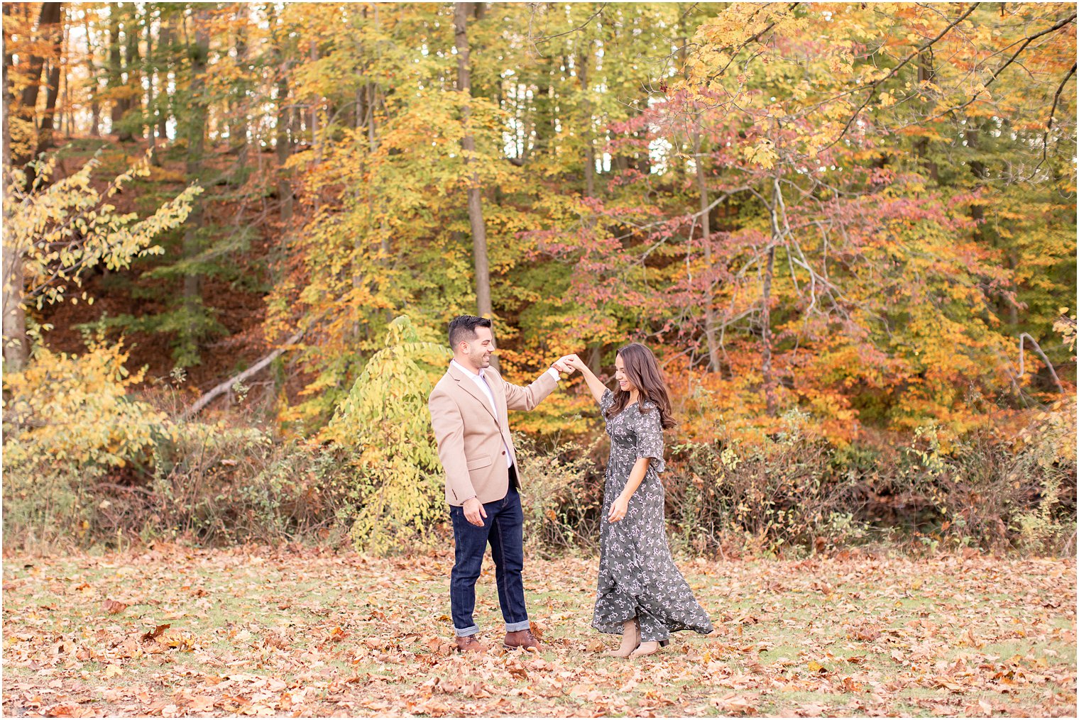 engaged couple laughing during their engagement session 