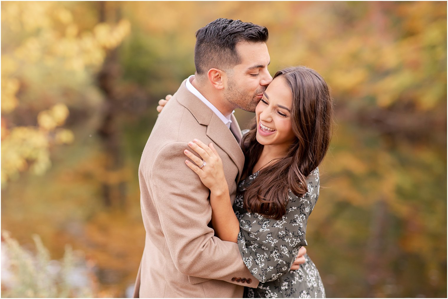 engaged couple laughing during their engagement session 