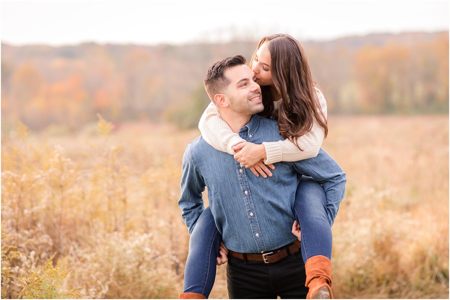 piggy back ride during fall engagement session at Natirar Park