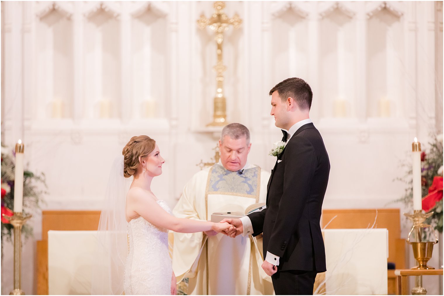 Bride and groom exchanging rings at St. Peter the Apostle in New Brunswick NJ
