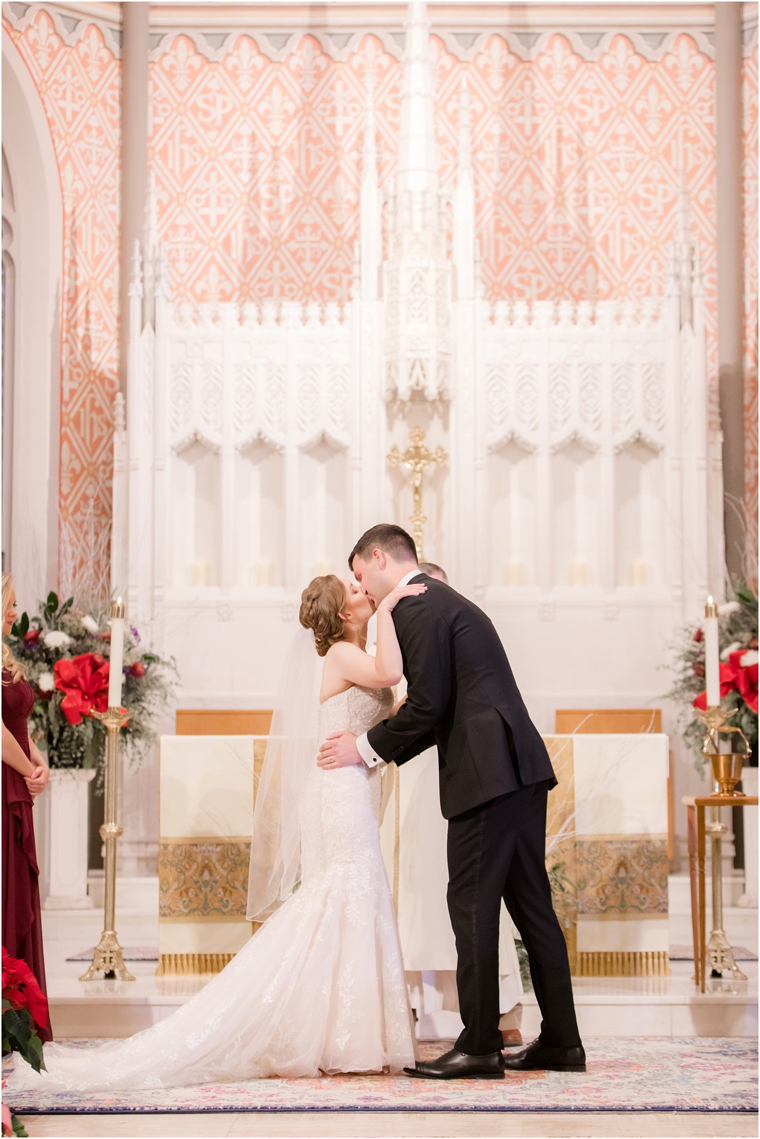 Bride and groom's first kiss during wedding ceremony at St. Peter the Apostle in New Brunswick NJ