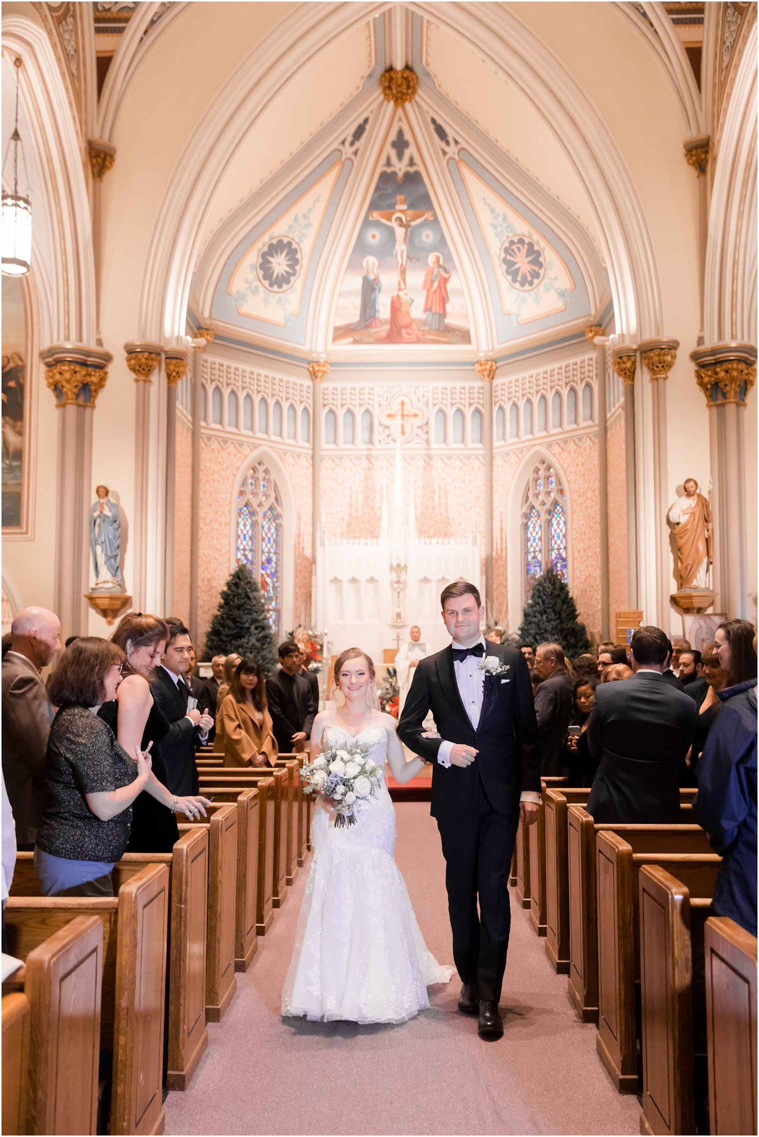 Bride and groom walking down the aisle at St. Peter the Apostle