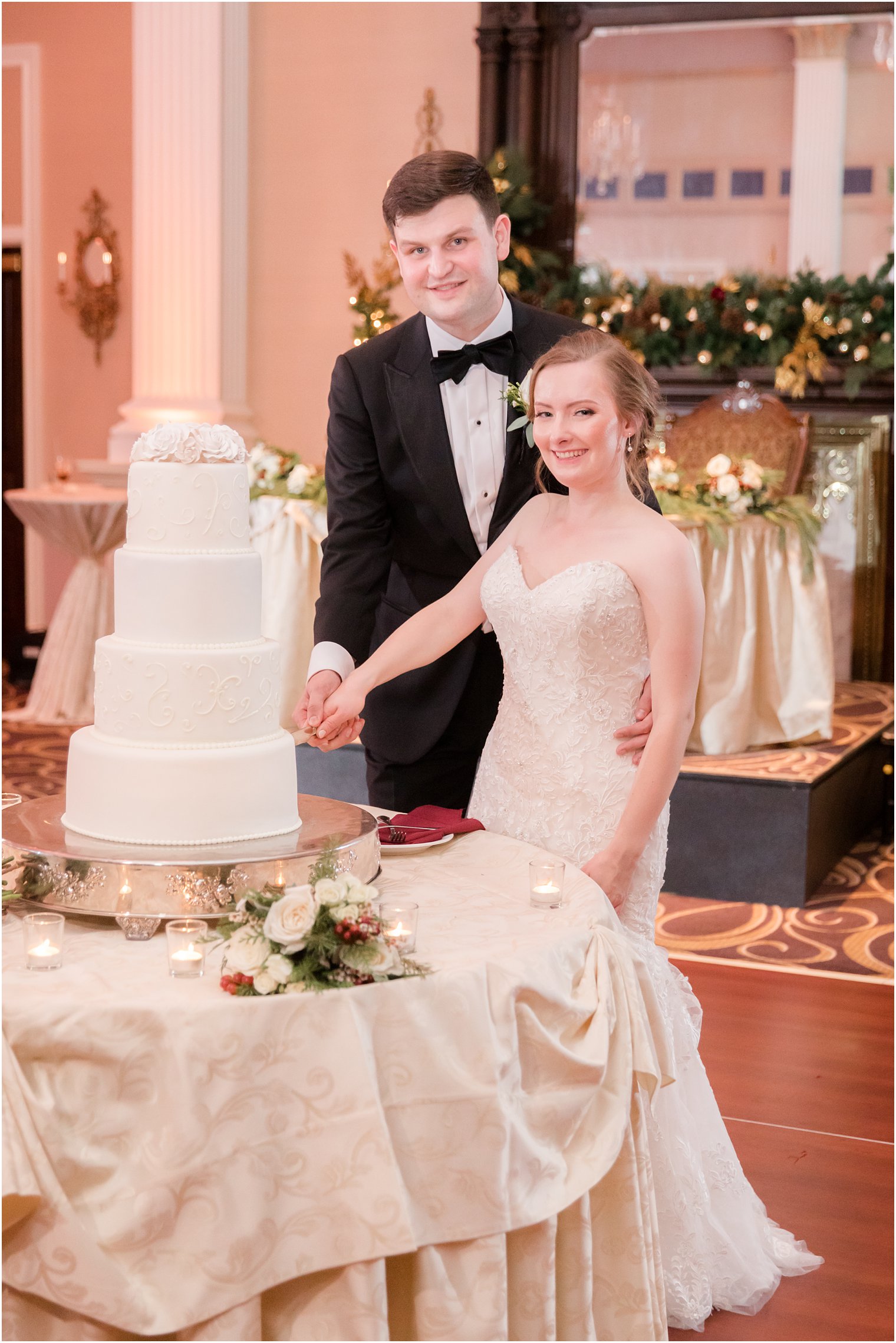 Bride and groom cutting wedding cake at The Palace at Somerset Park in Somerset NJ