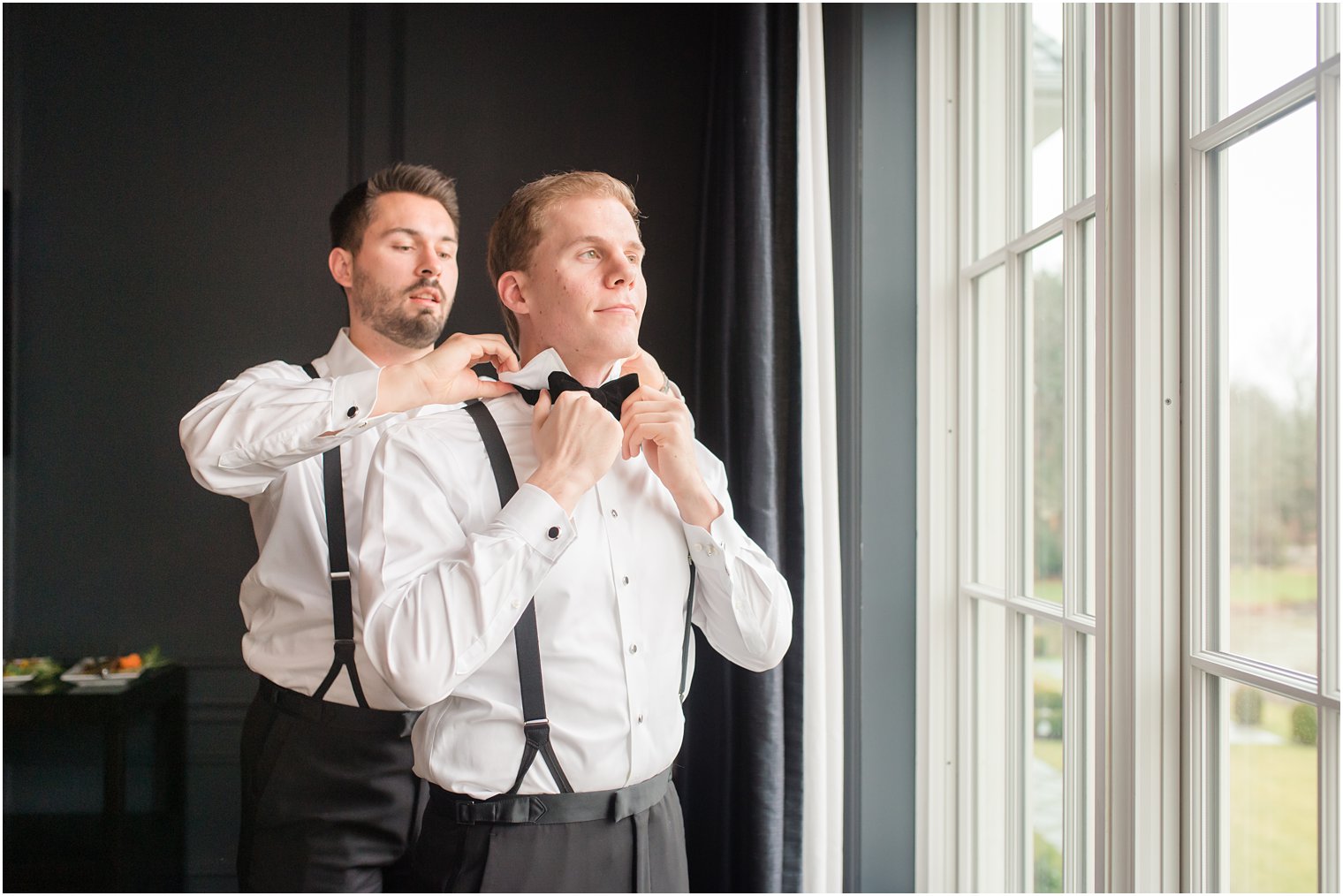 groom getting ready in groom's suite