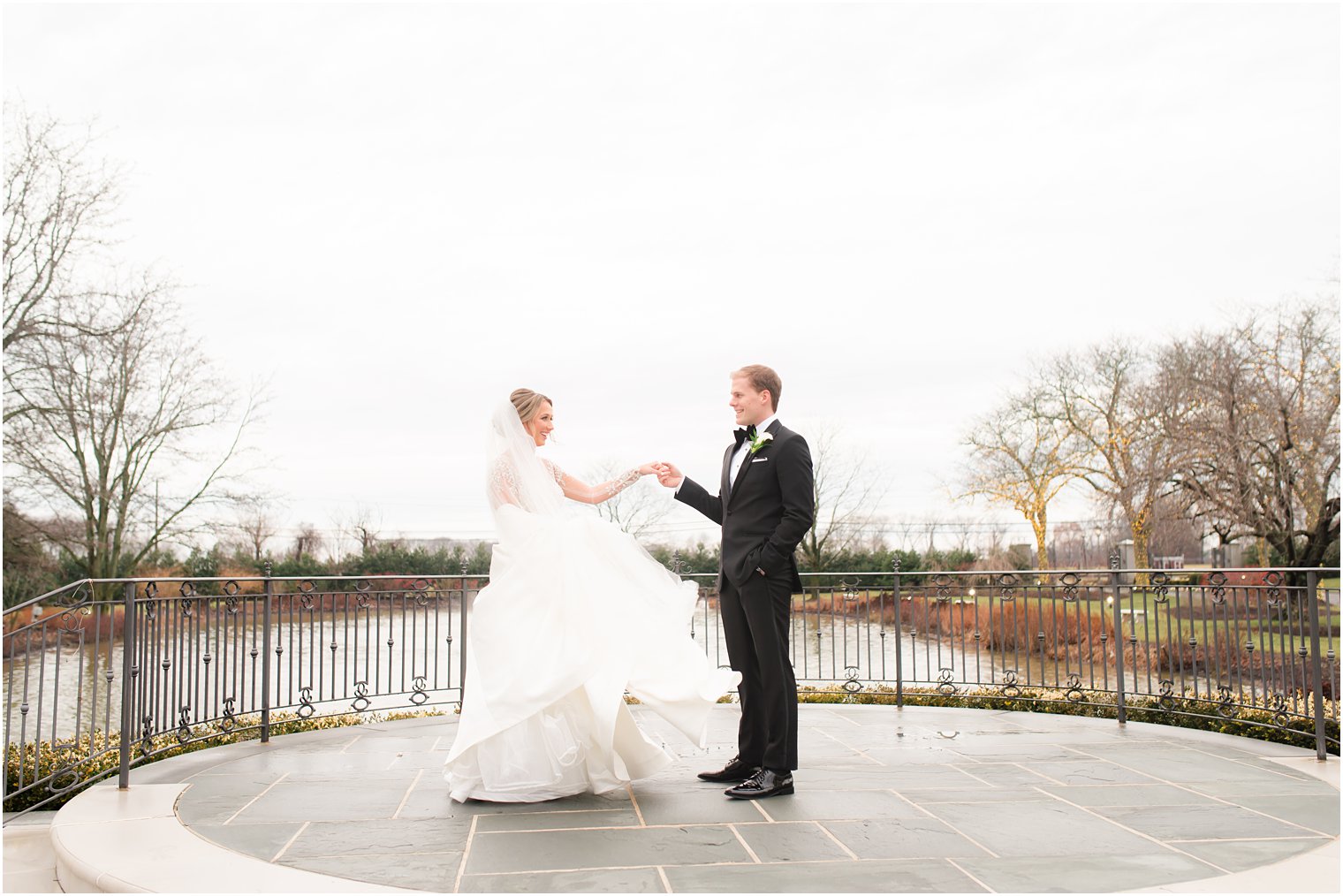 Groom twirling bride at Winter wedding at Park Chateau Estate and Gardens