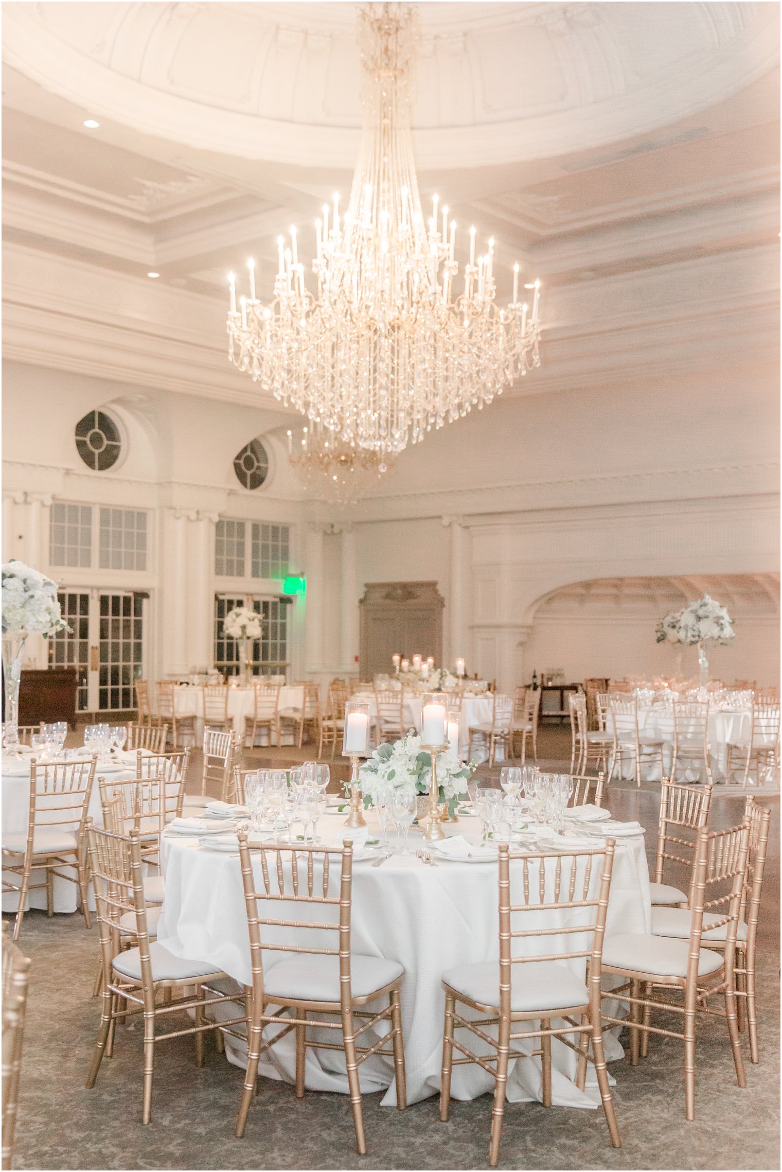 Elegant tables and center pieces in ballroom at Park Chateau Estate | Winter wedding by Idalia Photography Associates