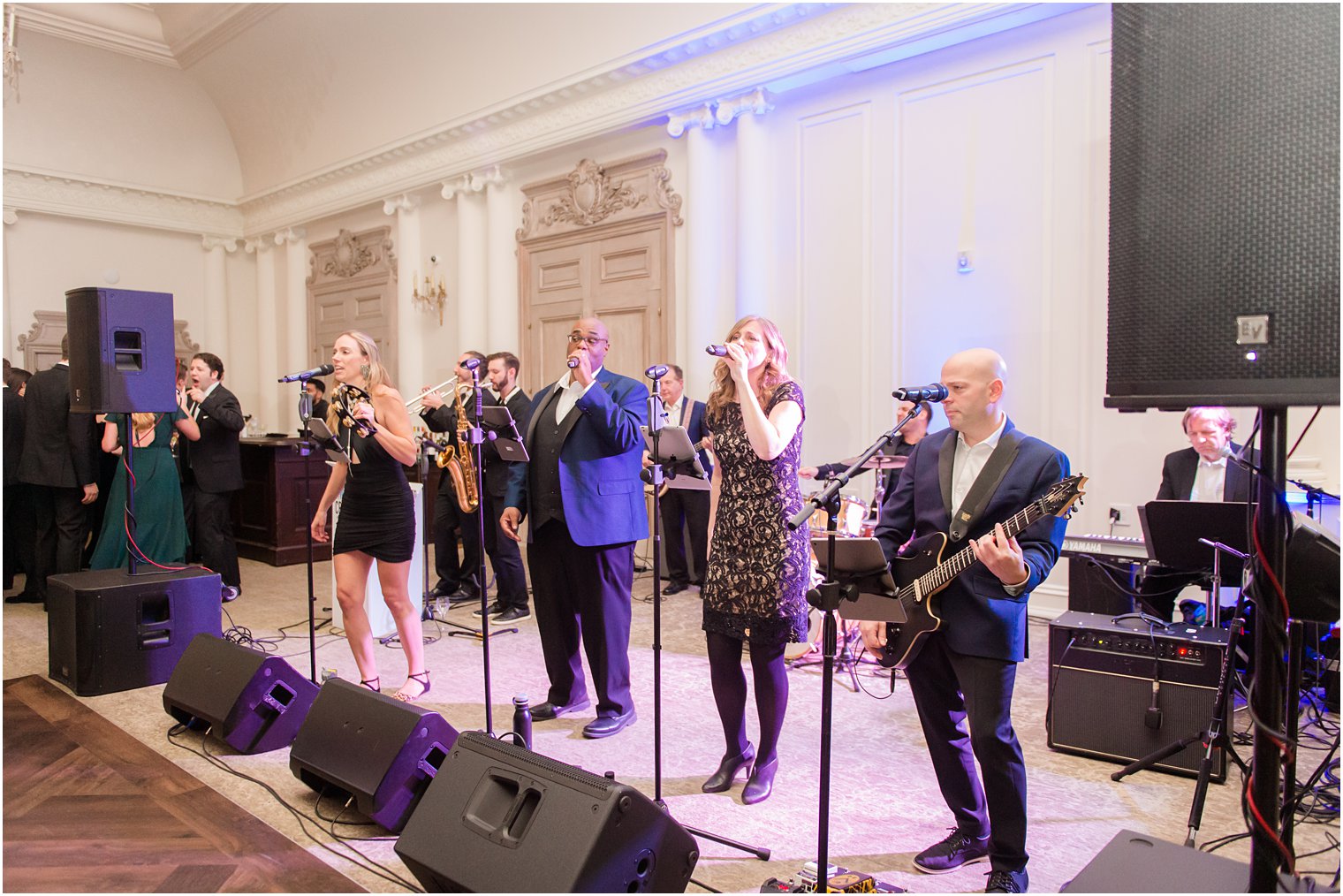 Band members singing at Park Chateau Winter Wedding