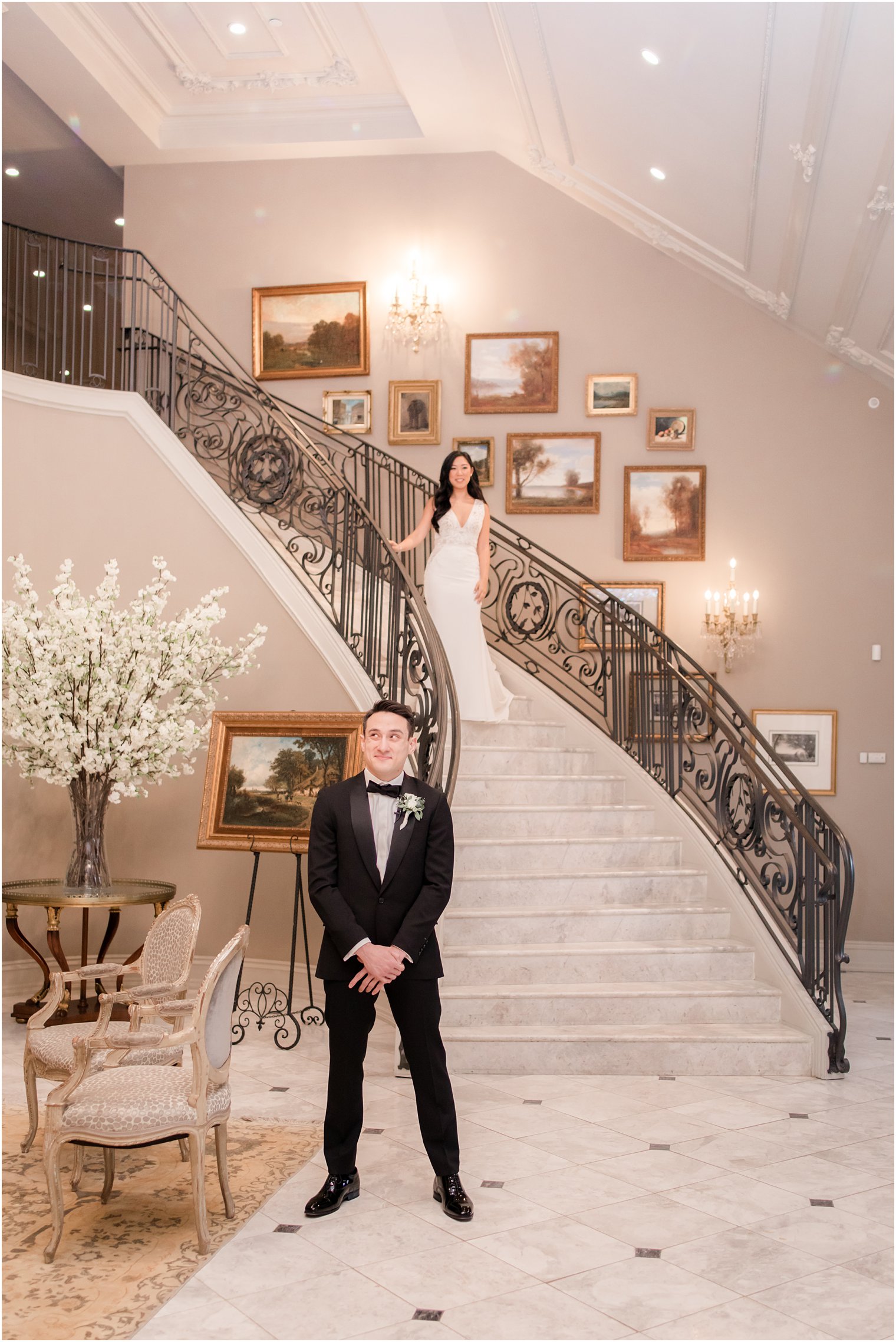 Bride coming down staircase for first look with groom on wedding day at Park Chateau Estate