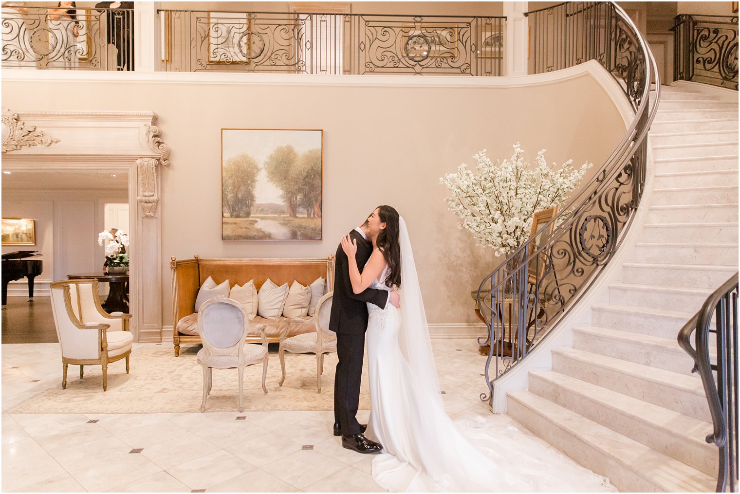 Bride coming down staircase for first look with groom on wedding day at Park Chateau Estate