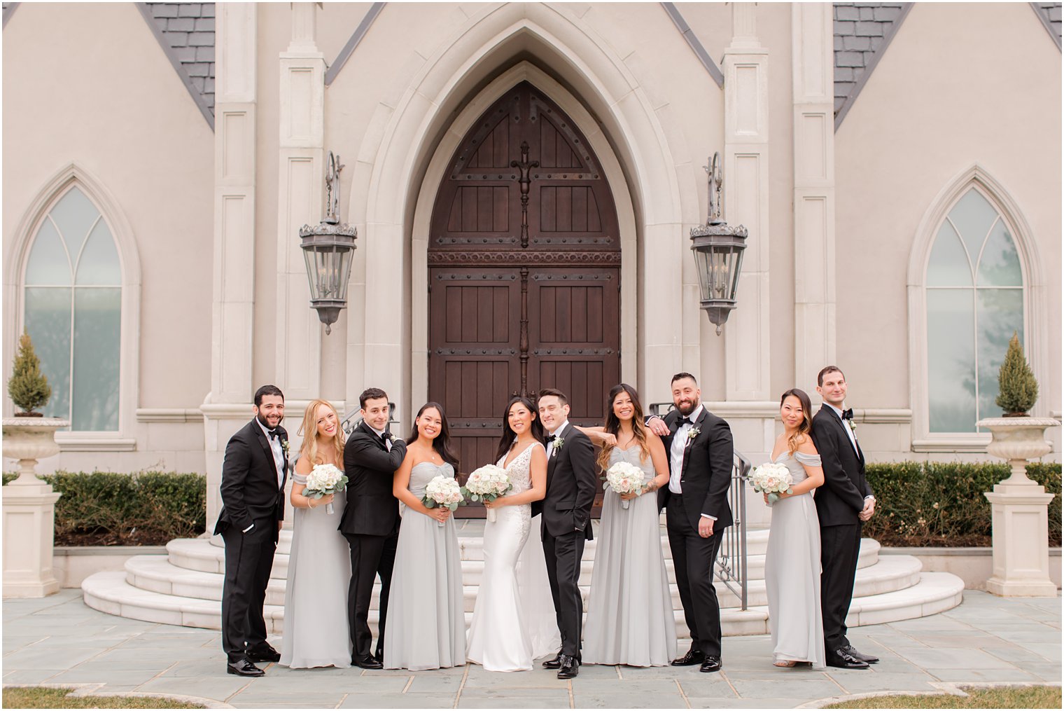 Elegant bridal party in front of Park Chateau Estate chapel