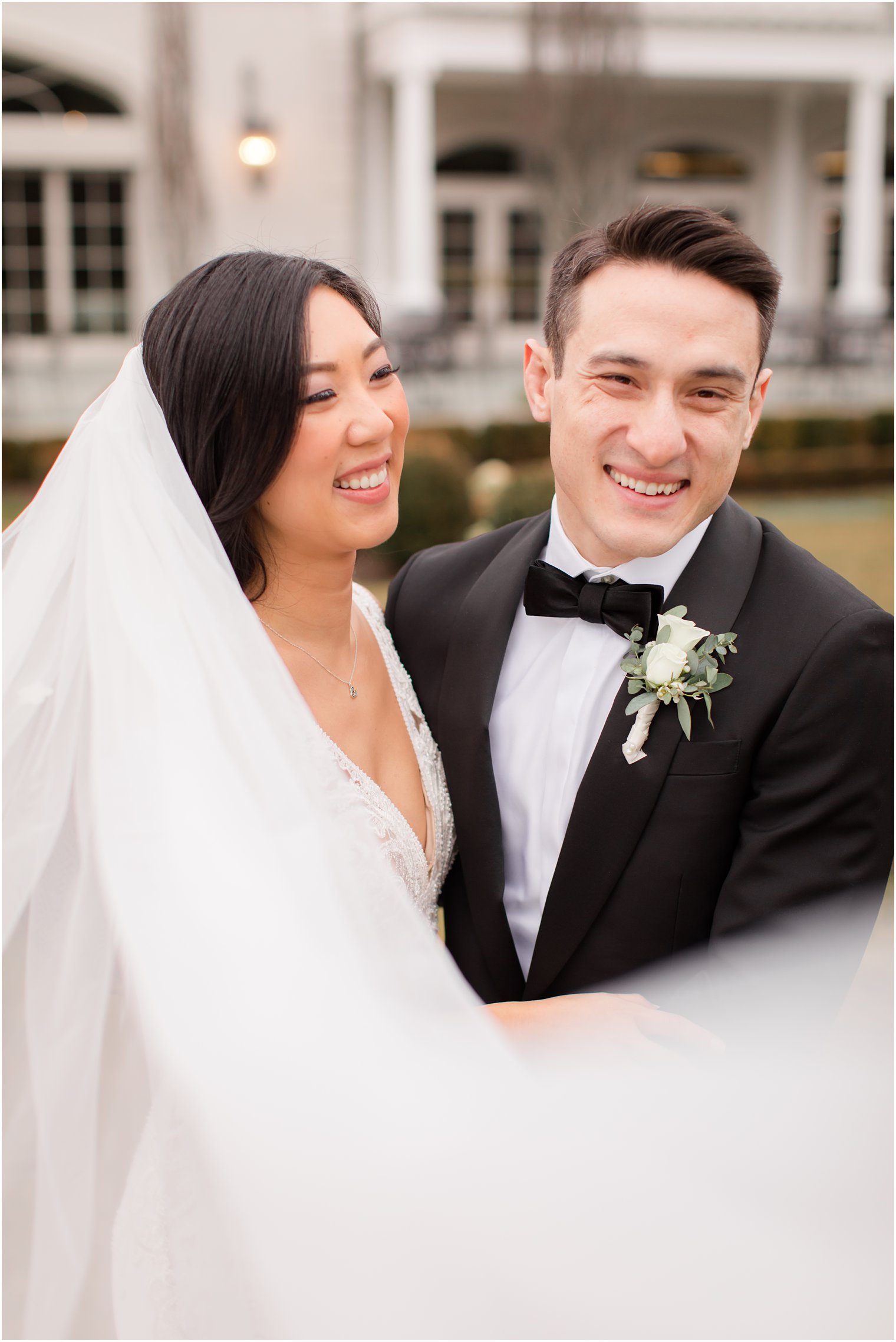 Candid photo between bride and groom at Park Chateau Estate