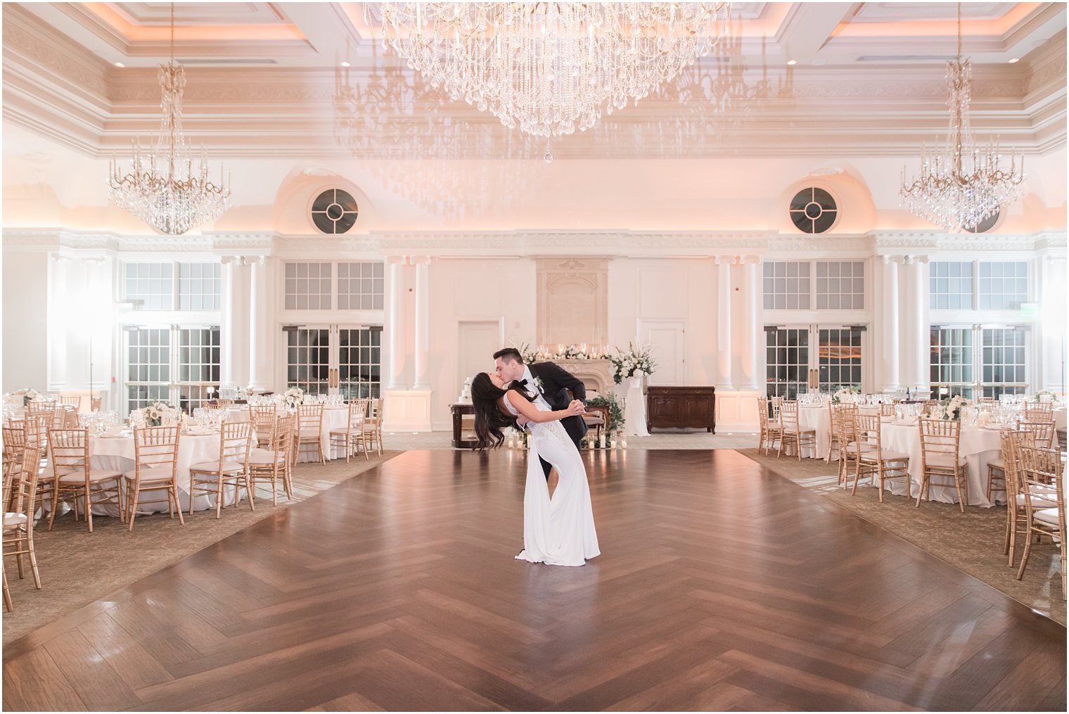 Bride and groom in empty ballroom at Park Chateau Estate