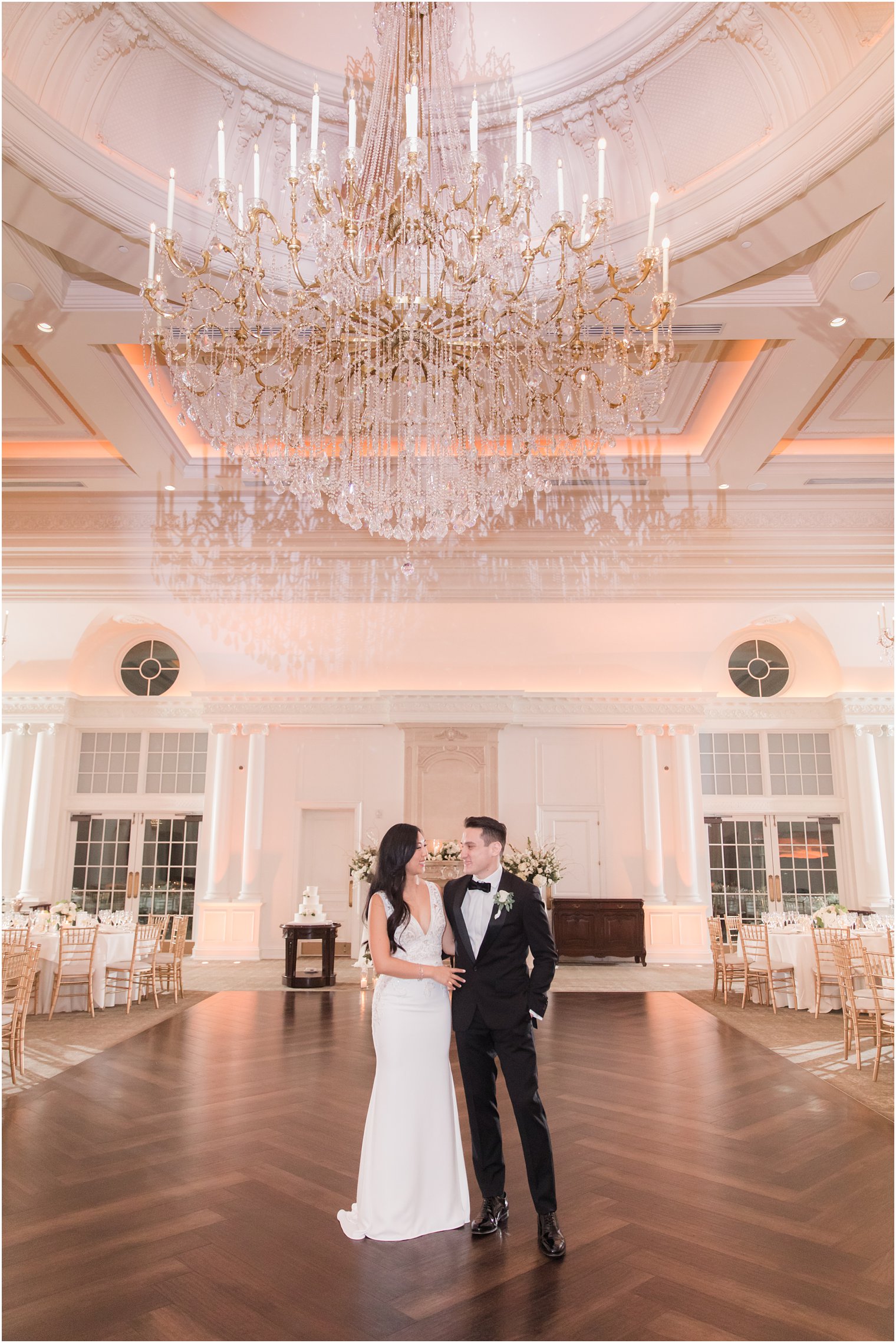 Bride and Groom portrait with elegant chandelier