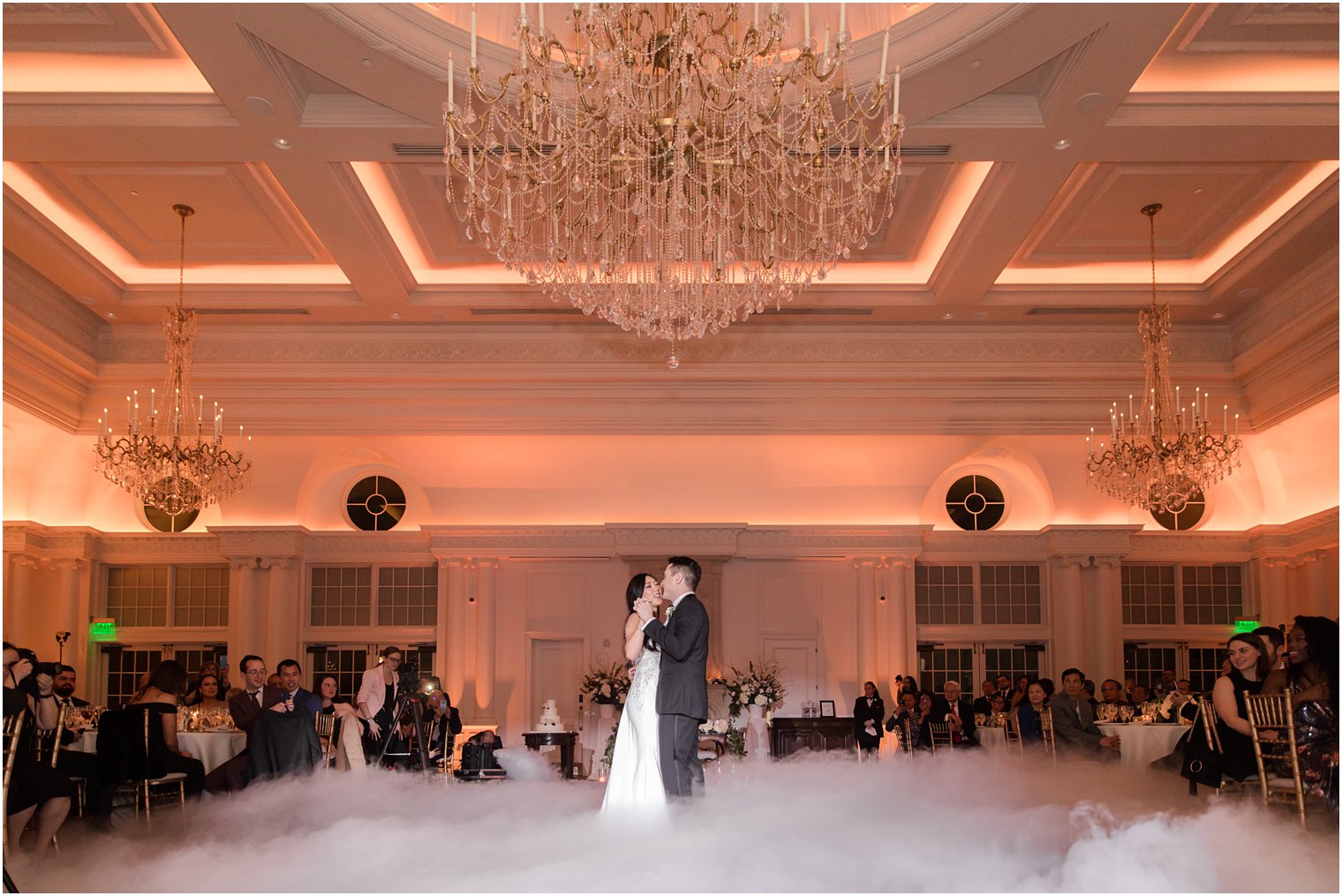 Bride and groom dancing in the clouds