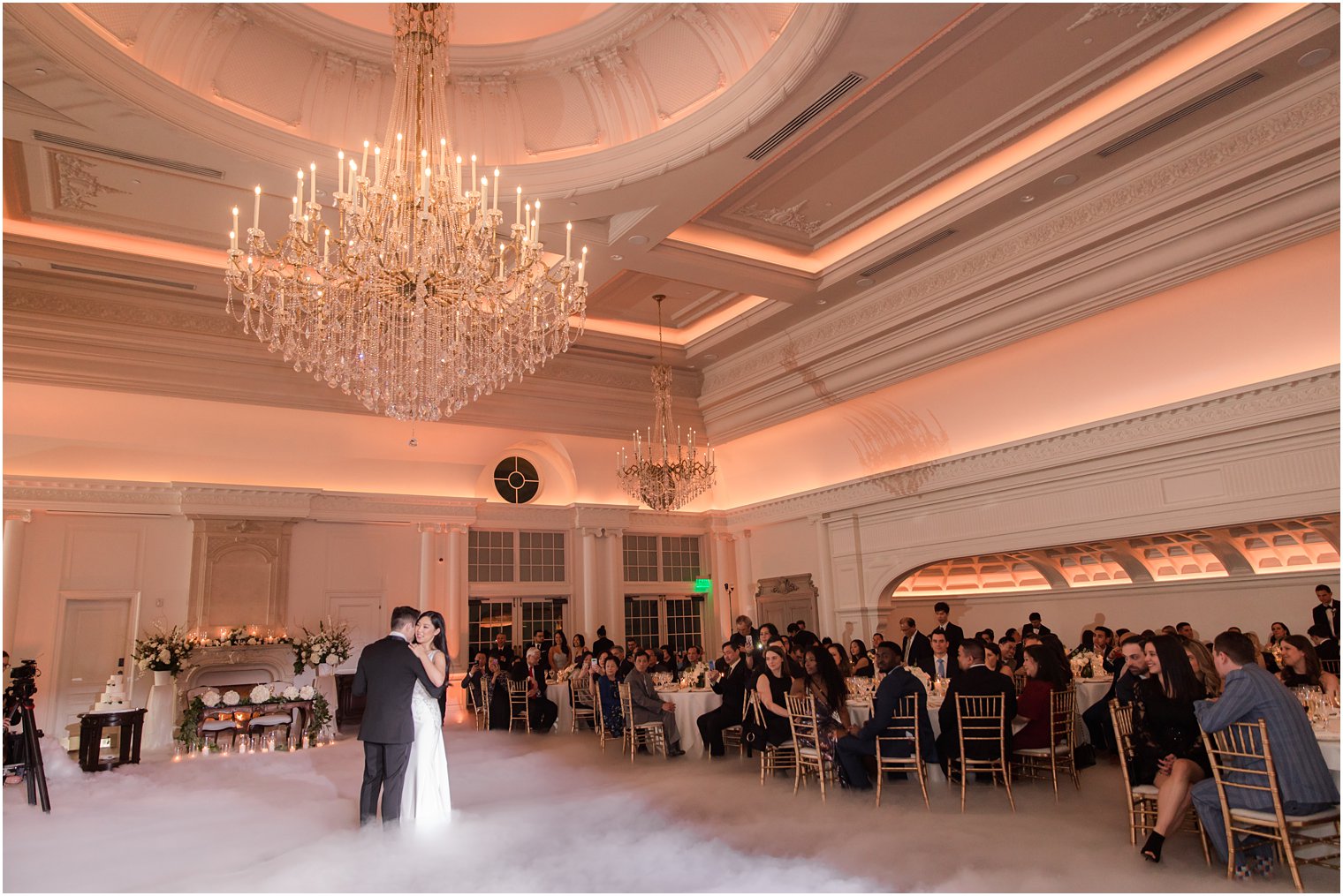 Bride and groom dancing in the clouds