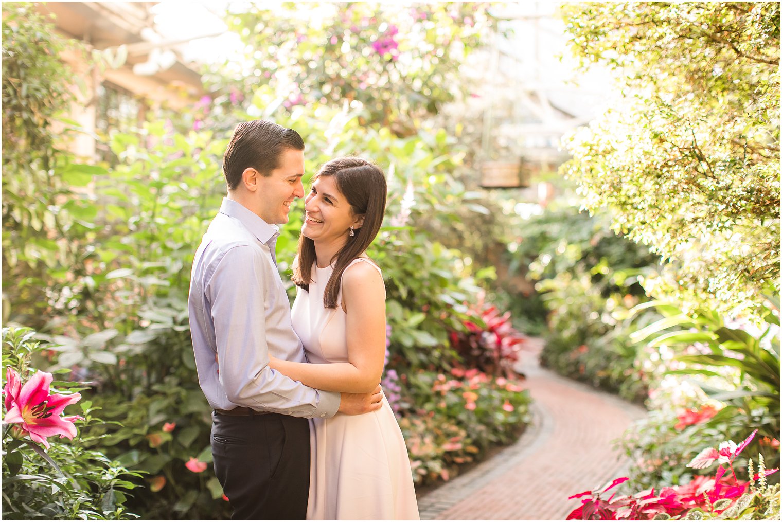 Couple laughing while posing for photos