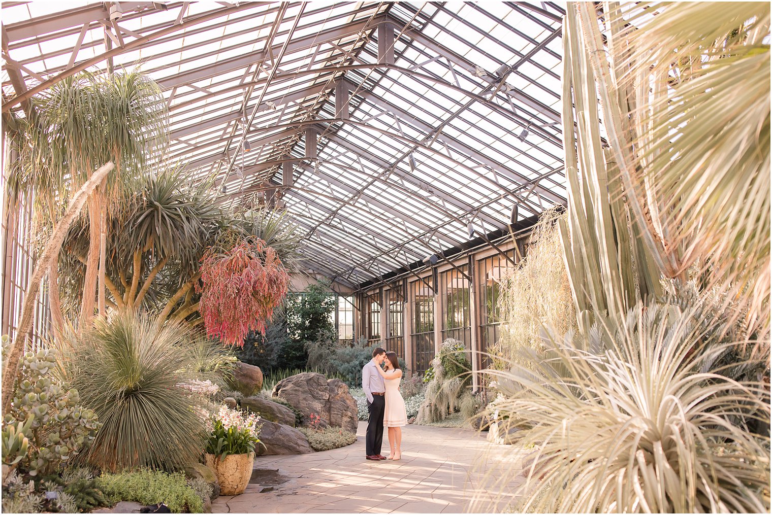 Romantic engagement photo in greenhouse at Longwood Gardens