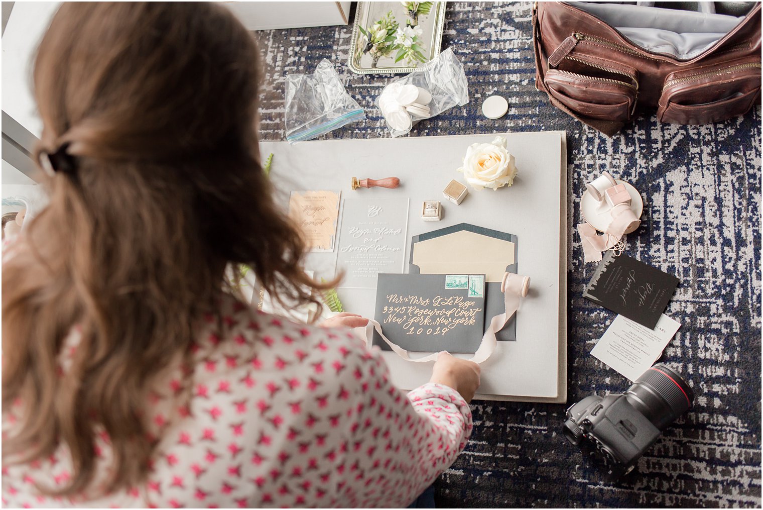 Behind-the-scenes photo of a wedding invitation flat lay