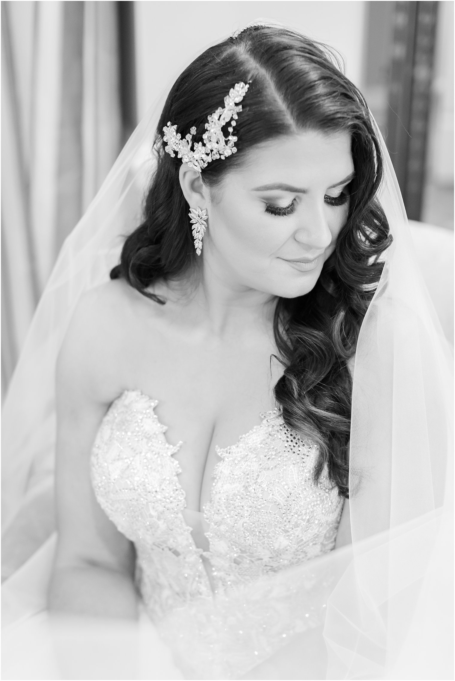 Romantic black and white bridal portrait with veil 