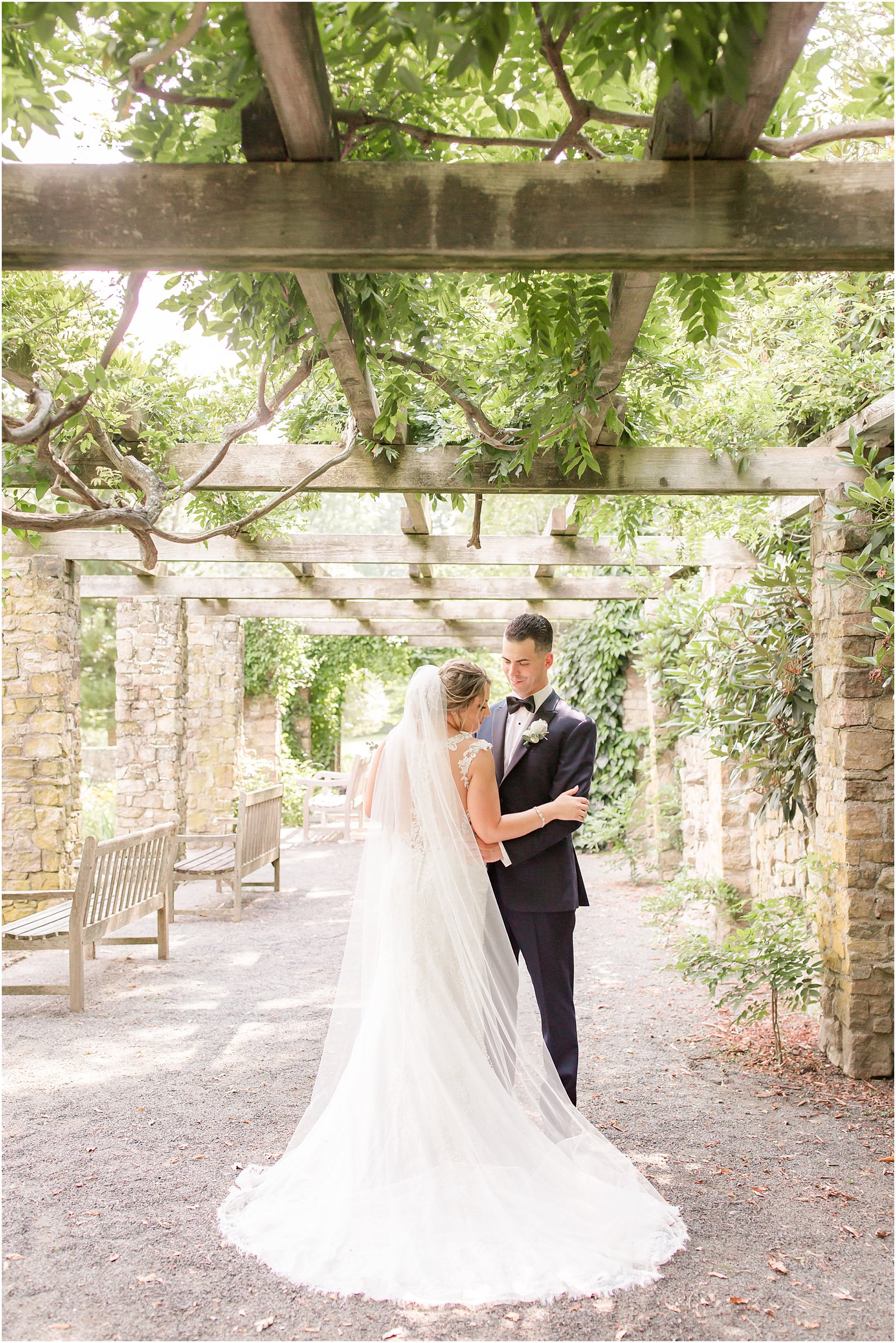 Romantic wedding photo of bride and groom at Cross Estate Gardens