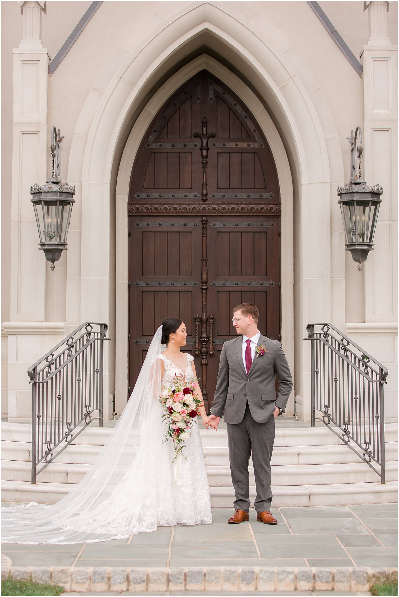 Bride and groom standing in front of the chapel at Park Chateau Estate