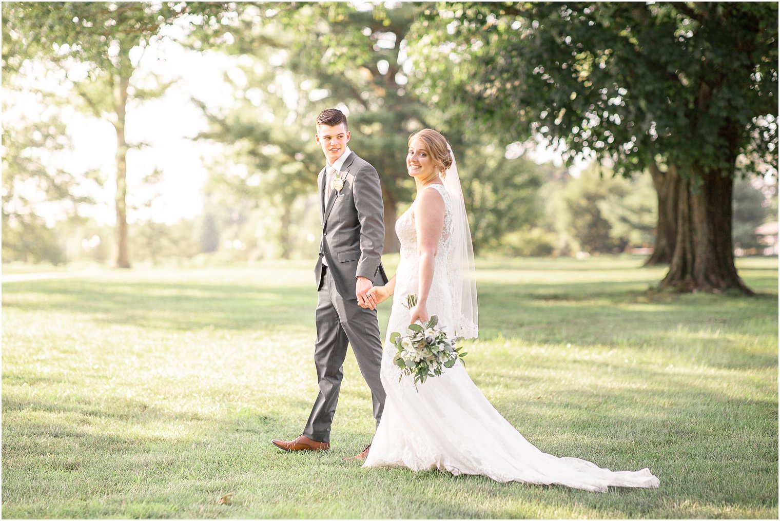 Bride walking with her groom at Battleground Country Club in Manalapan NJ