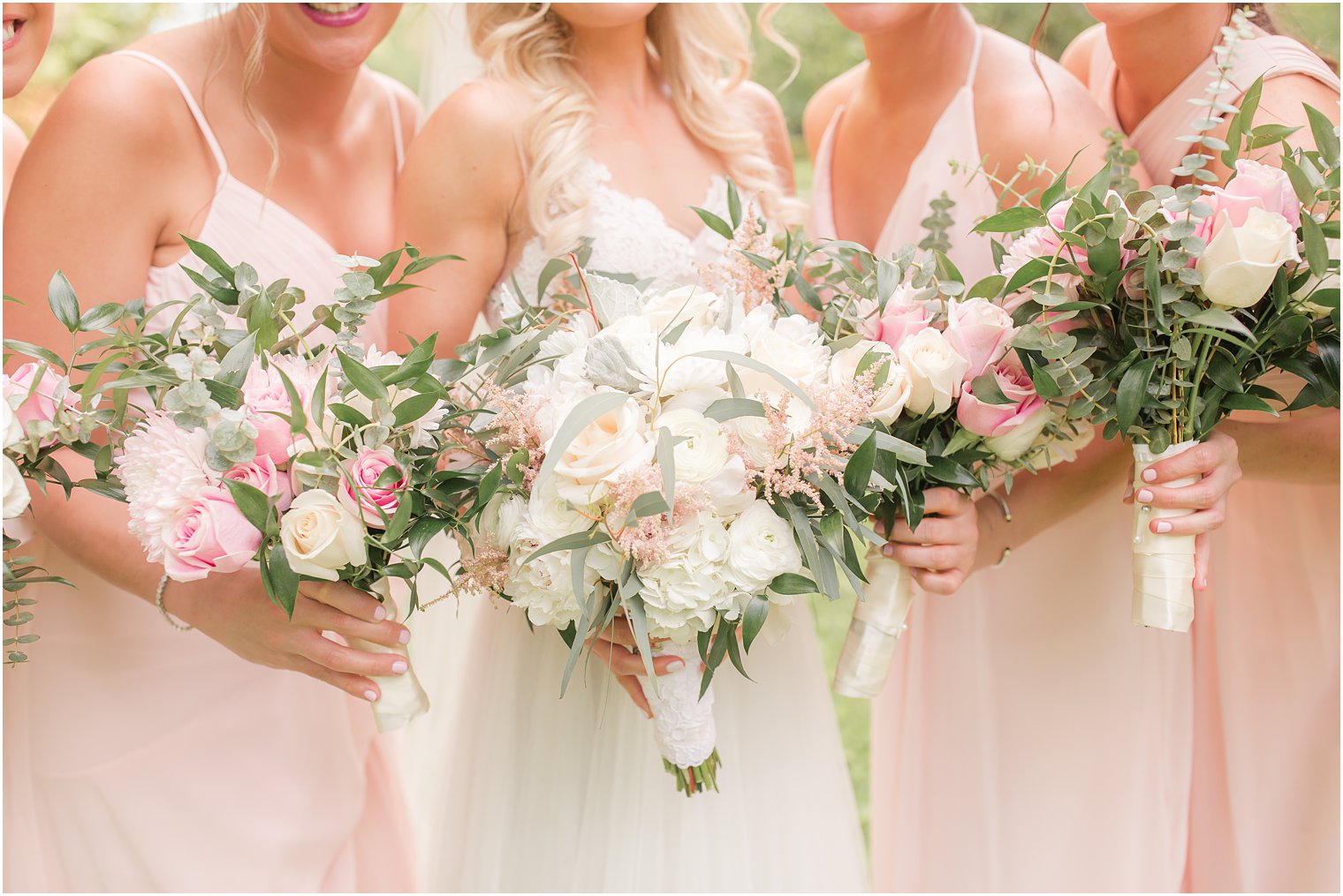 Bridesmaids bouquets by Dalsimer Spitz and Peck Florist