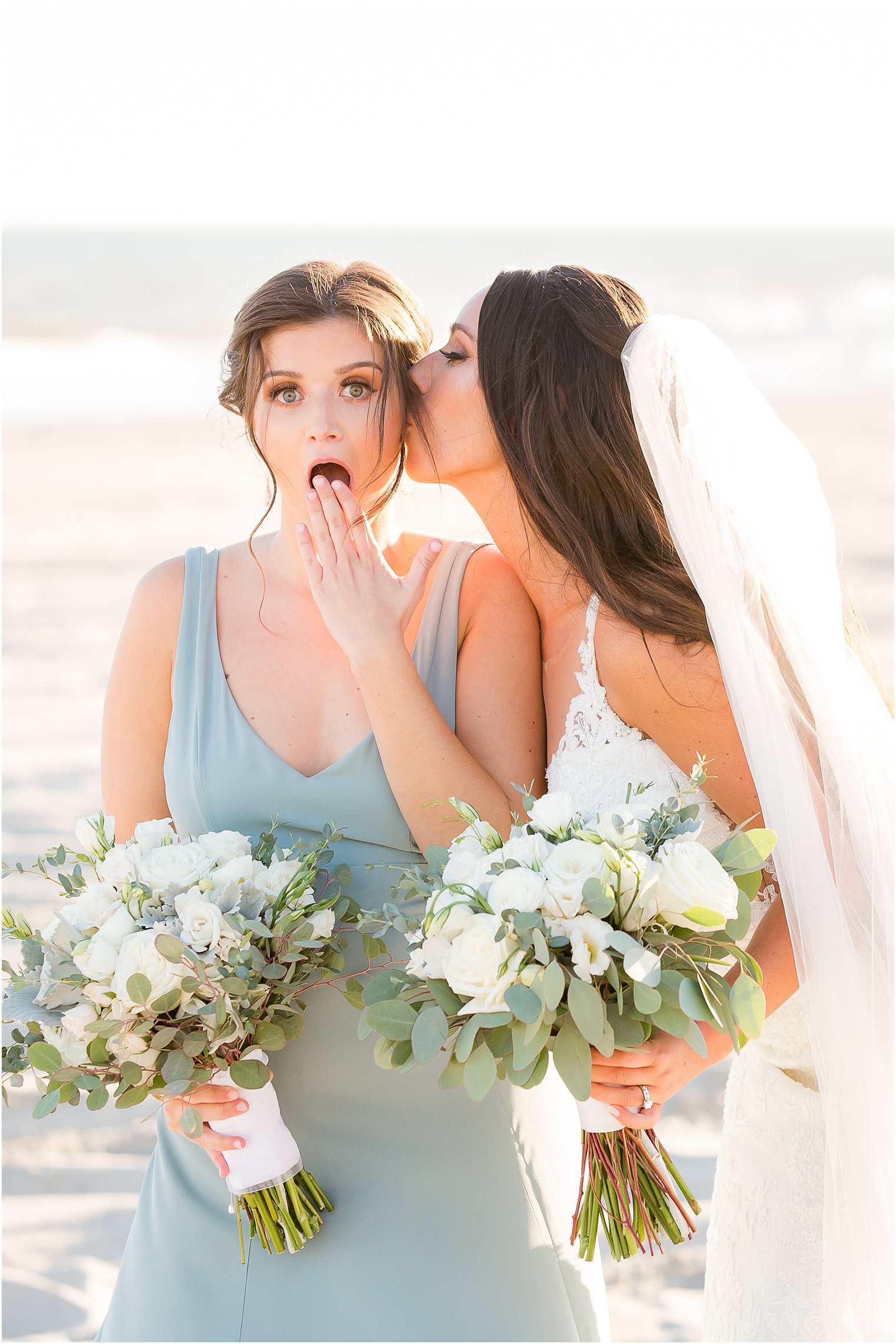 Bride kissing bridemaid
