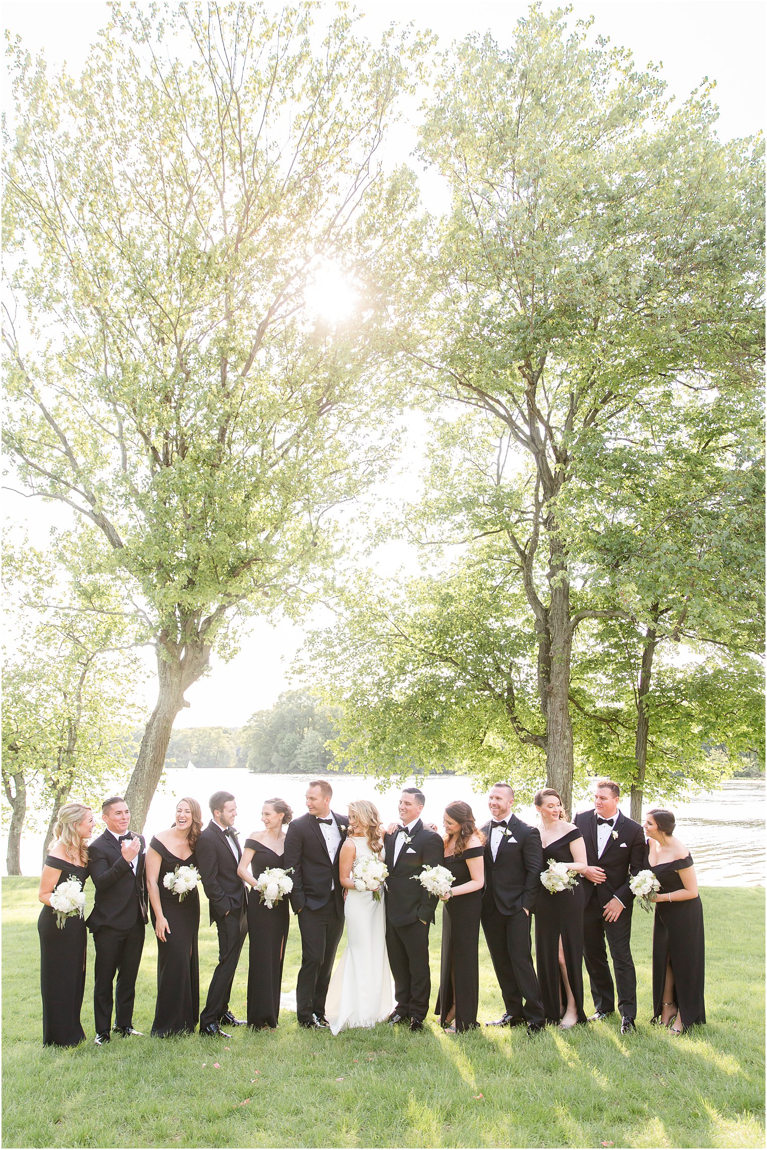 Wedding party wearing black dresses and black tuxedos