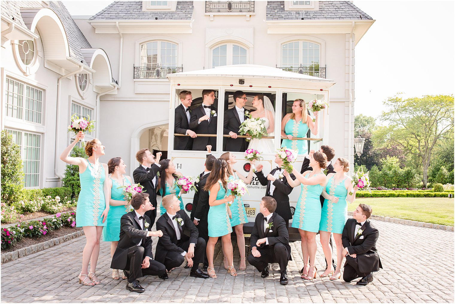 Bridal party posing with trolley 