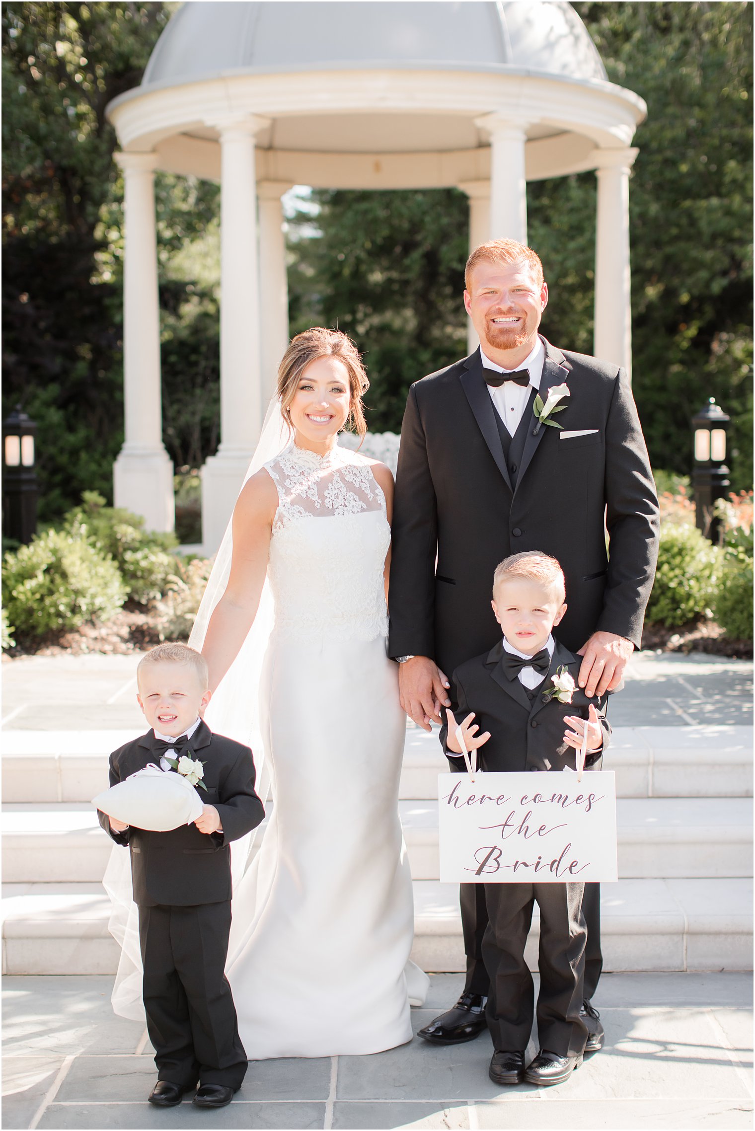 Formal photo of bride and groom with ring bearers