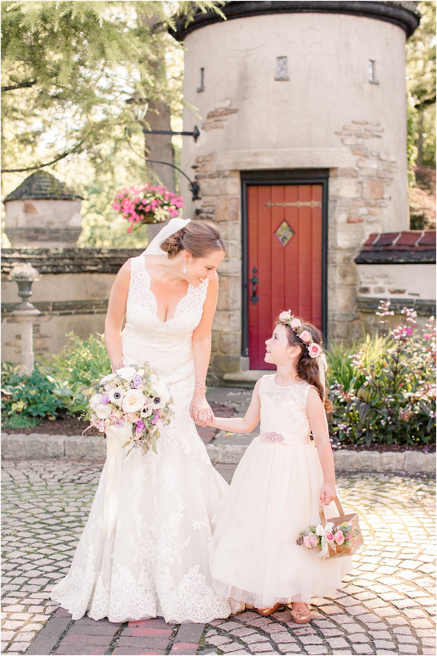 Bride smiling at flower girl