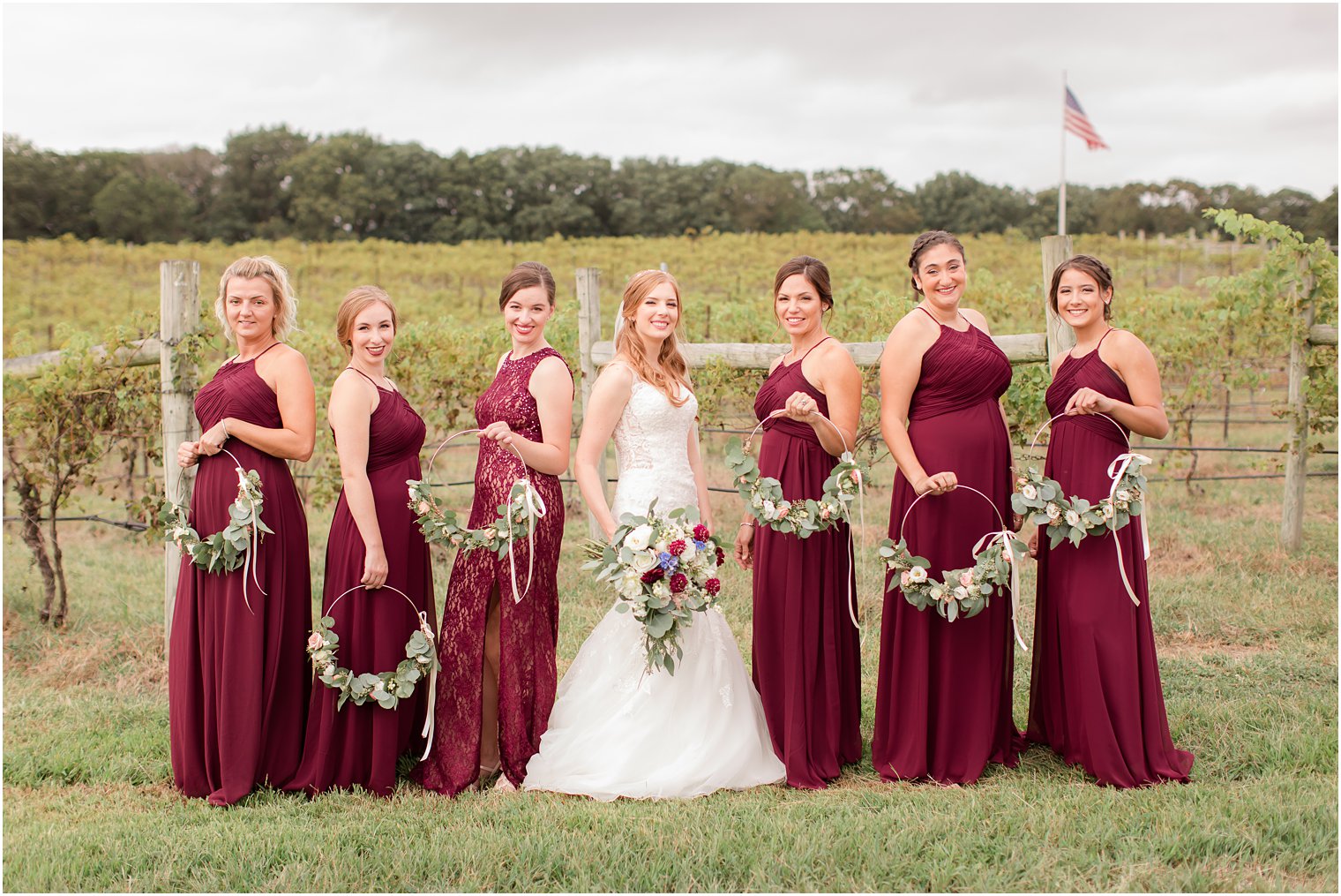 Bridesmaids at Laurita Winery with flower hoops 
