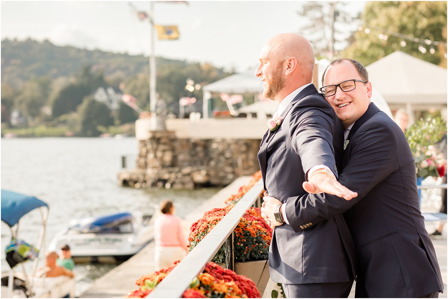 Groom hugging his groomsman