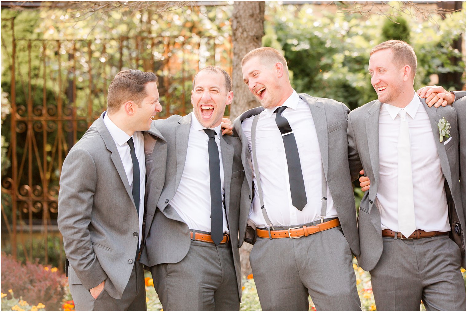 Candid photo of groomsmen laughing