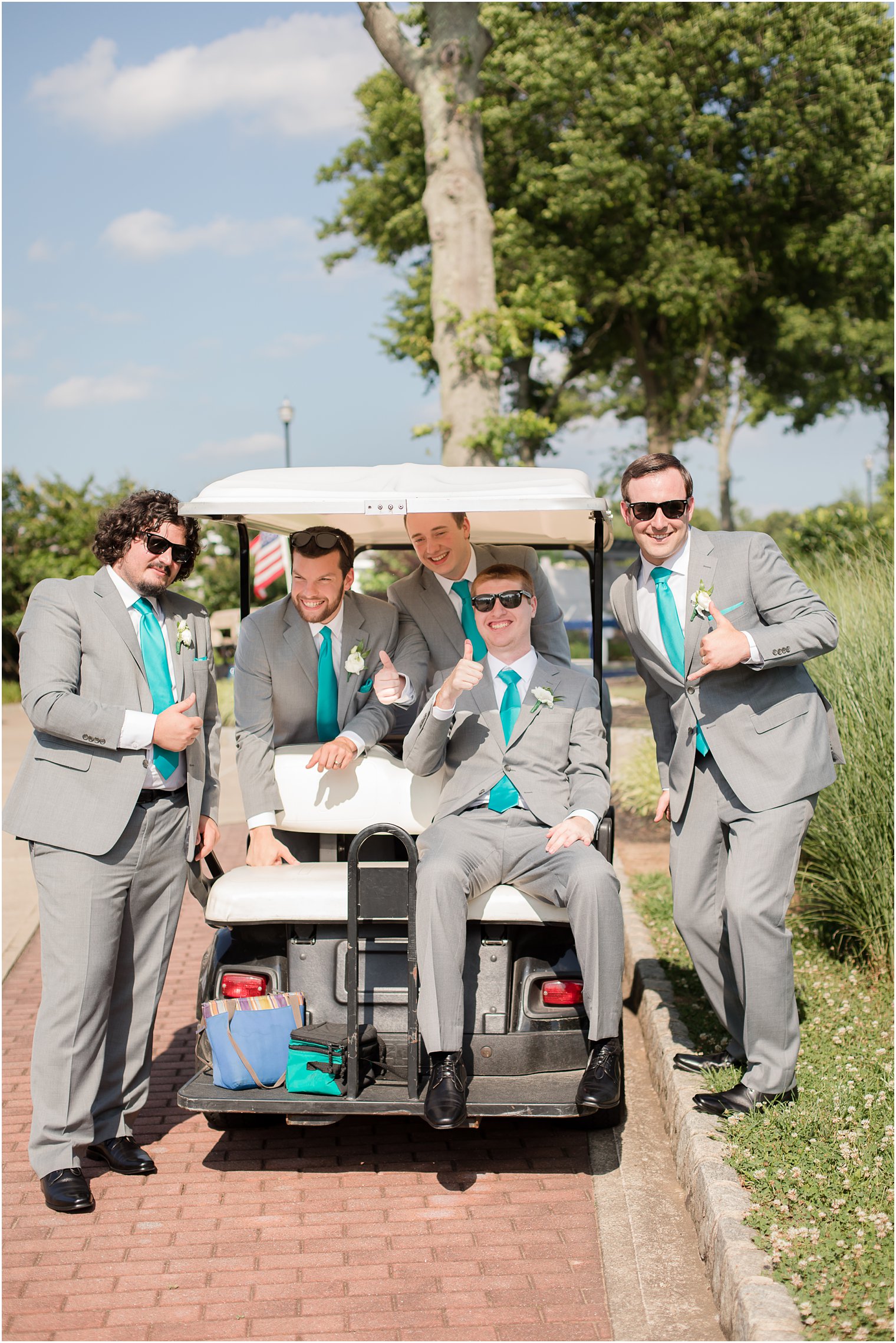Groomsmen waiting on golf cart