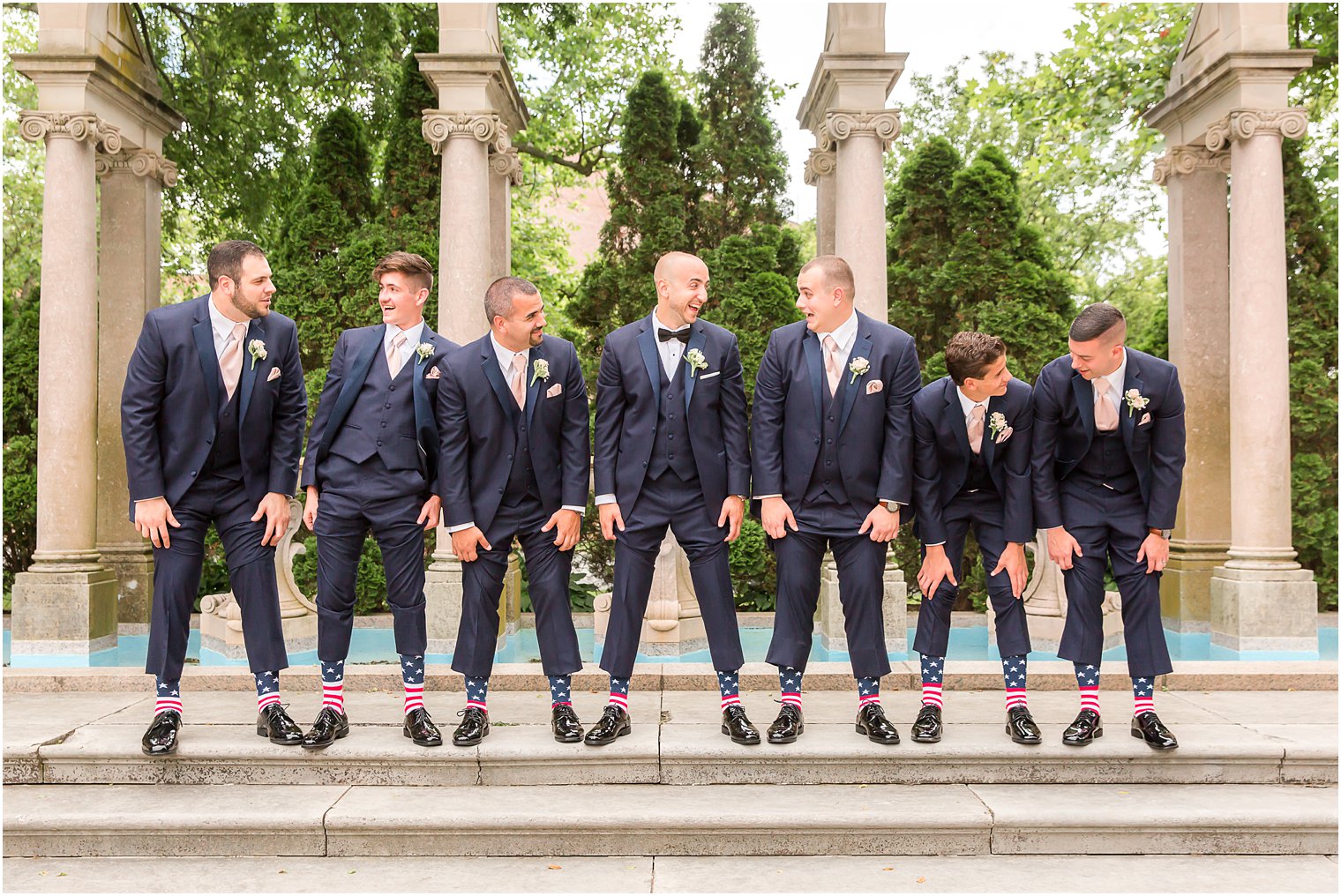 Groom and groomsmen showing off their socks