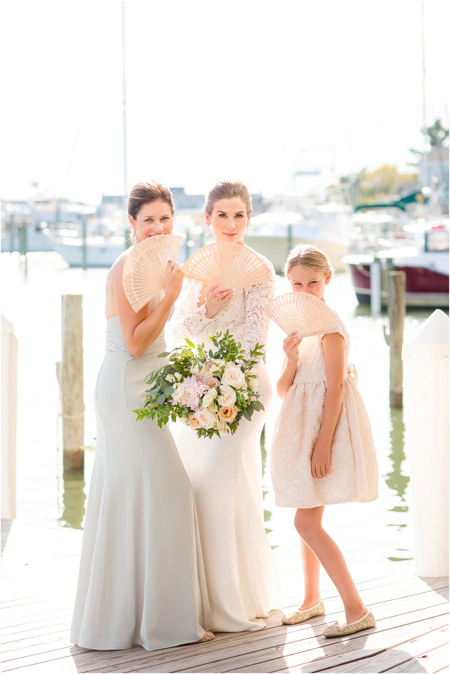 Bride and bridesmaids with fans