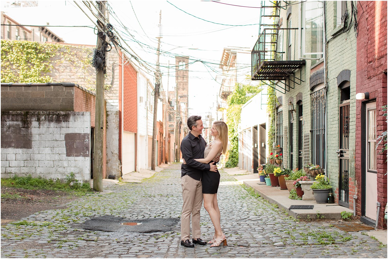 Engaged couple in Court Street in Hoboken, NJ