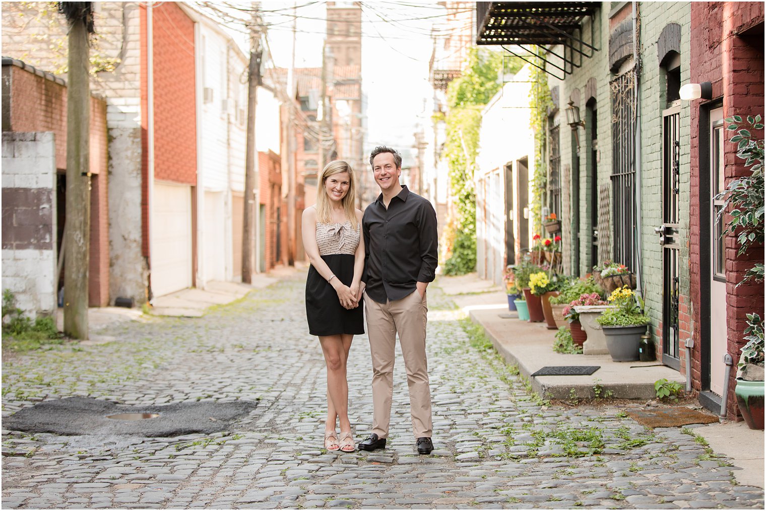 Engaged couple in Court Street in Hoboken, NJ