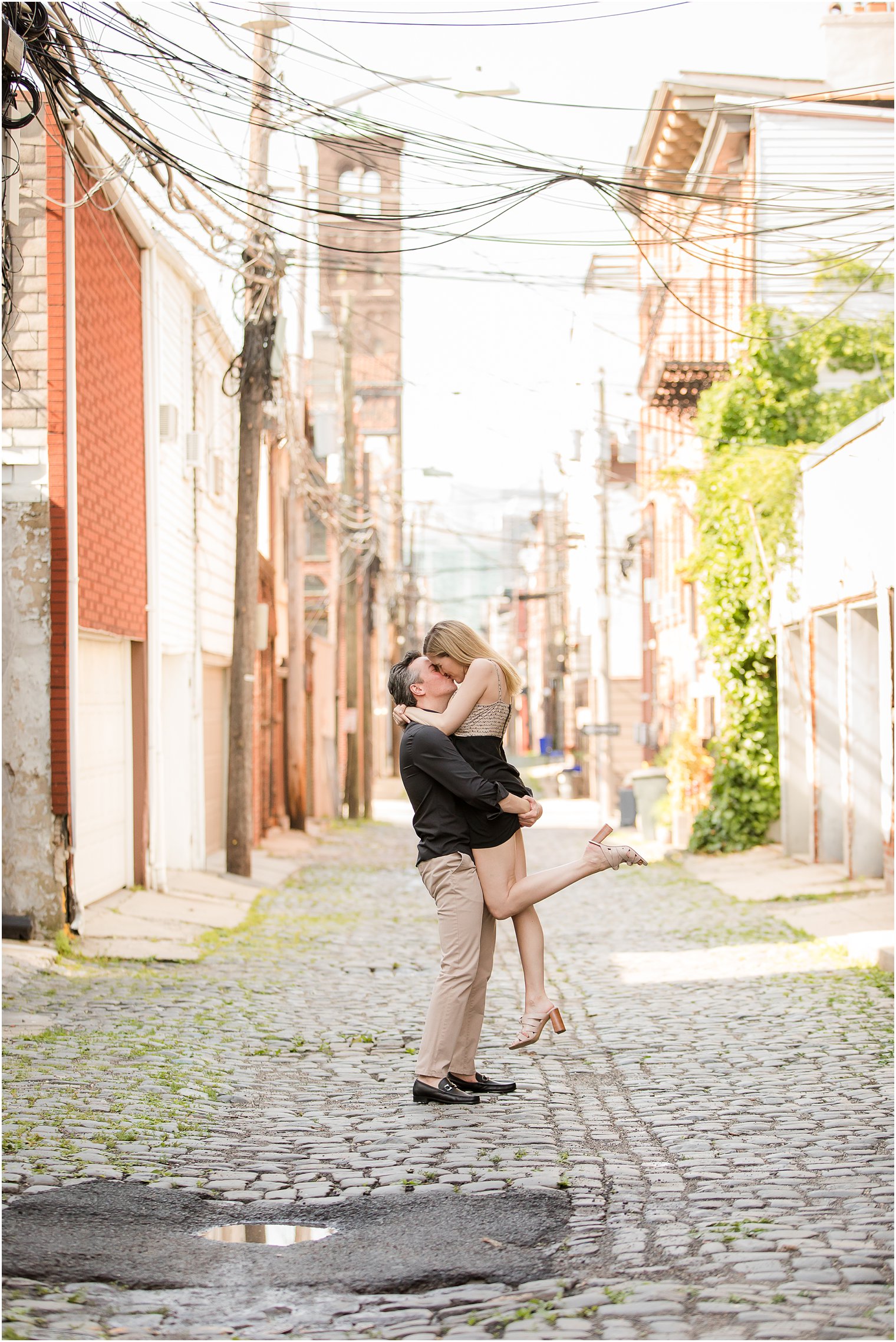 Groom lifting bride in Court Street