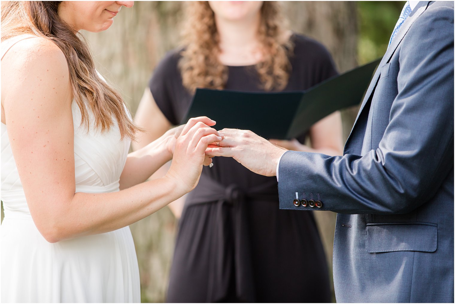 Exchange of rings | NJ backyard wedding by Idalia Photography