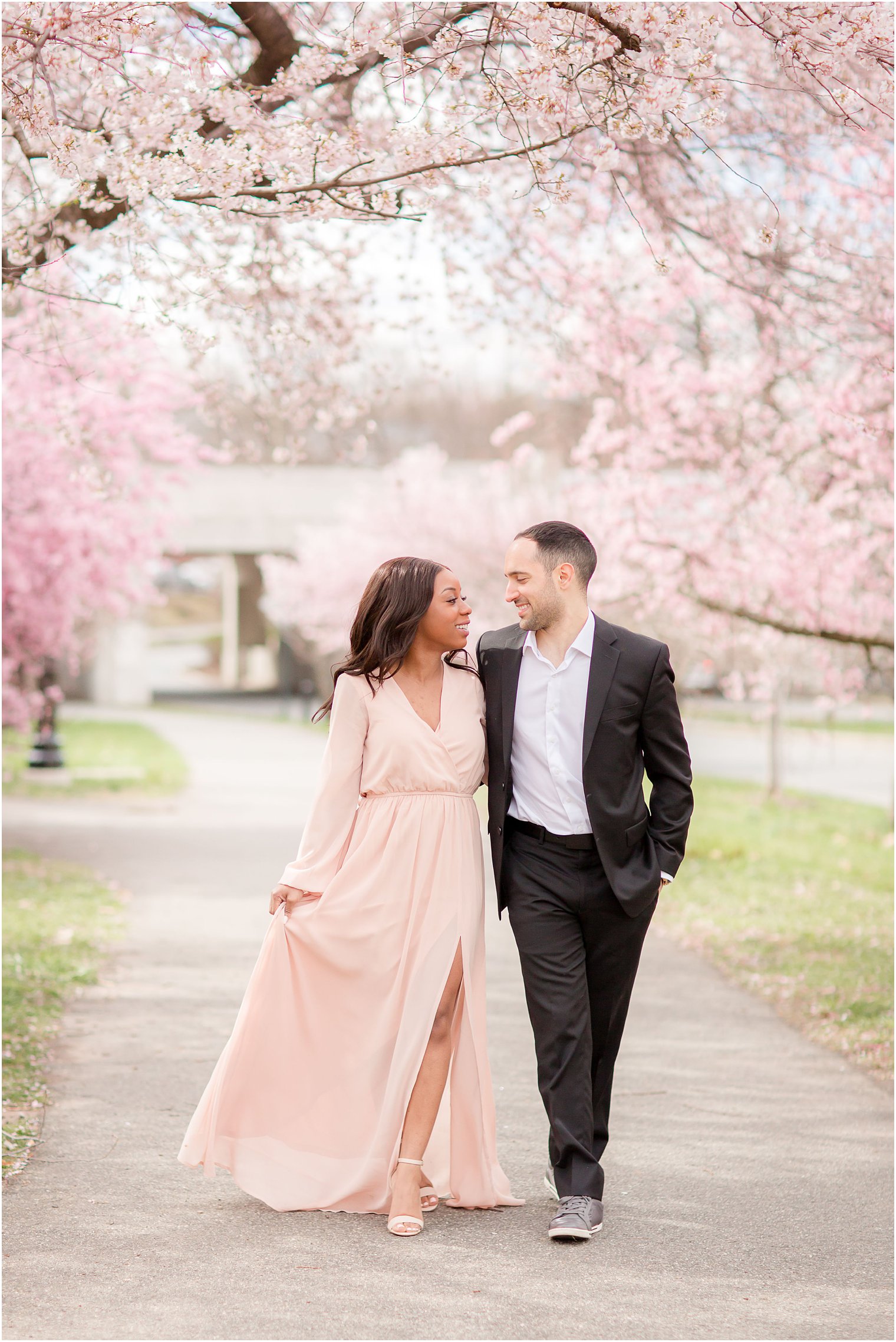 engagement session with cherry blossoms