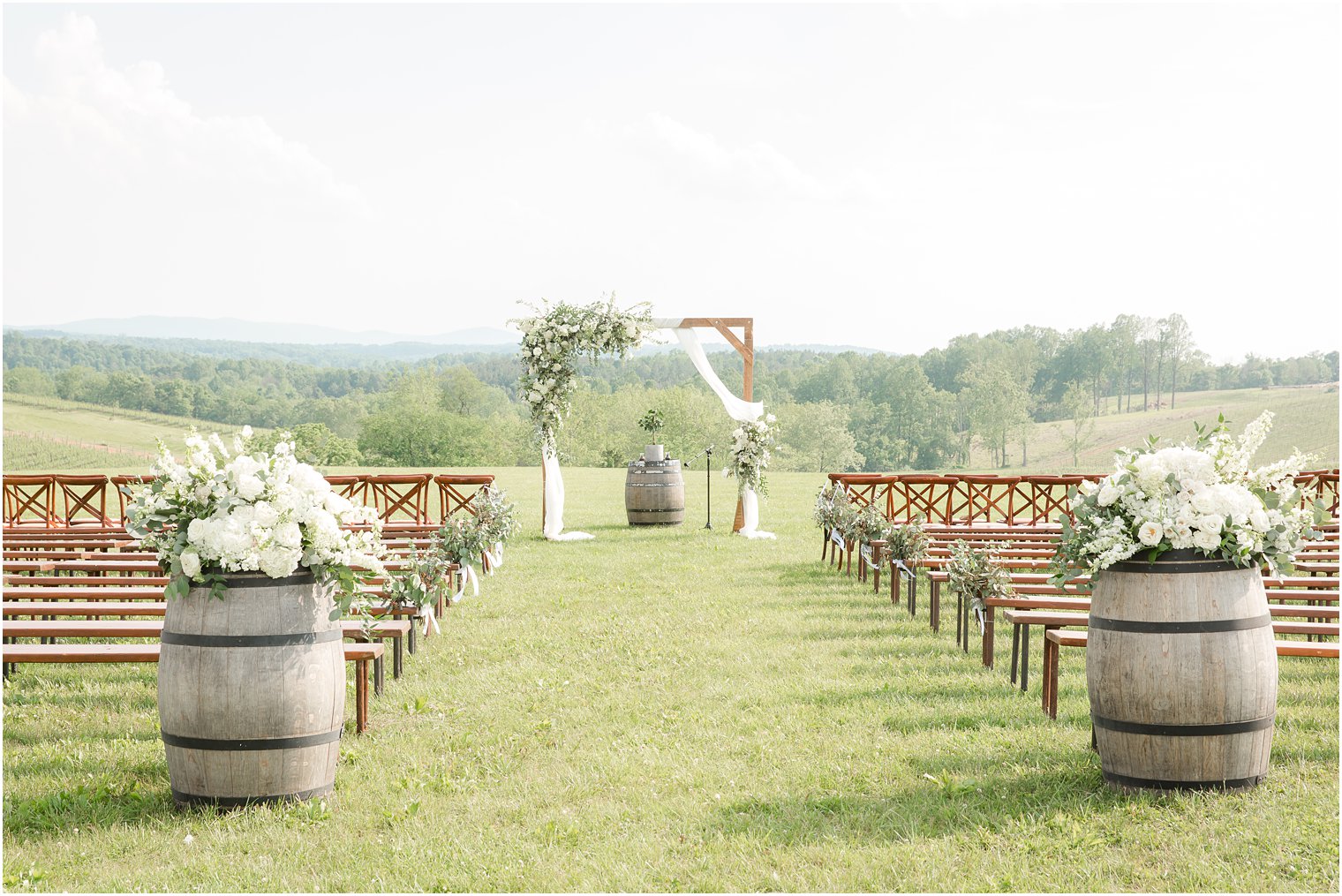 Wedding ceremony at Stone Tower Winery | Florals by Holly Chapple